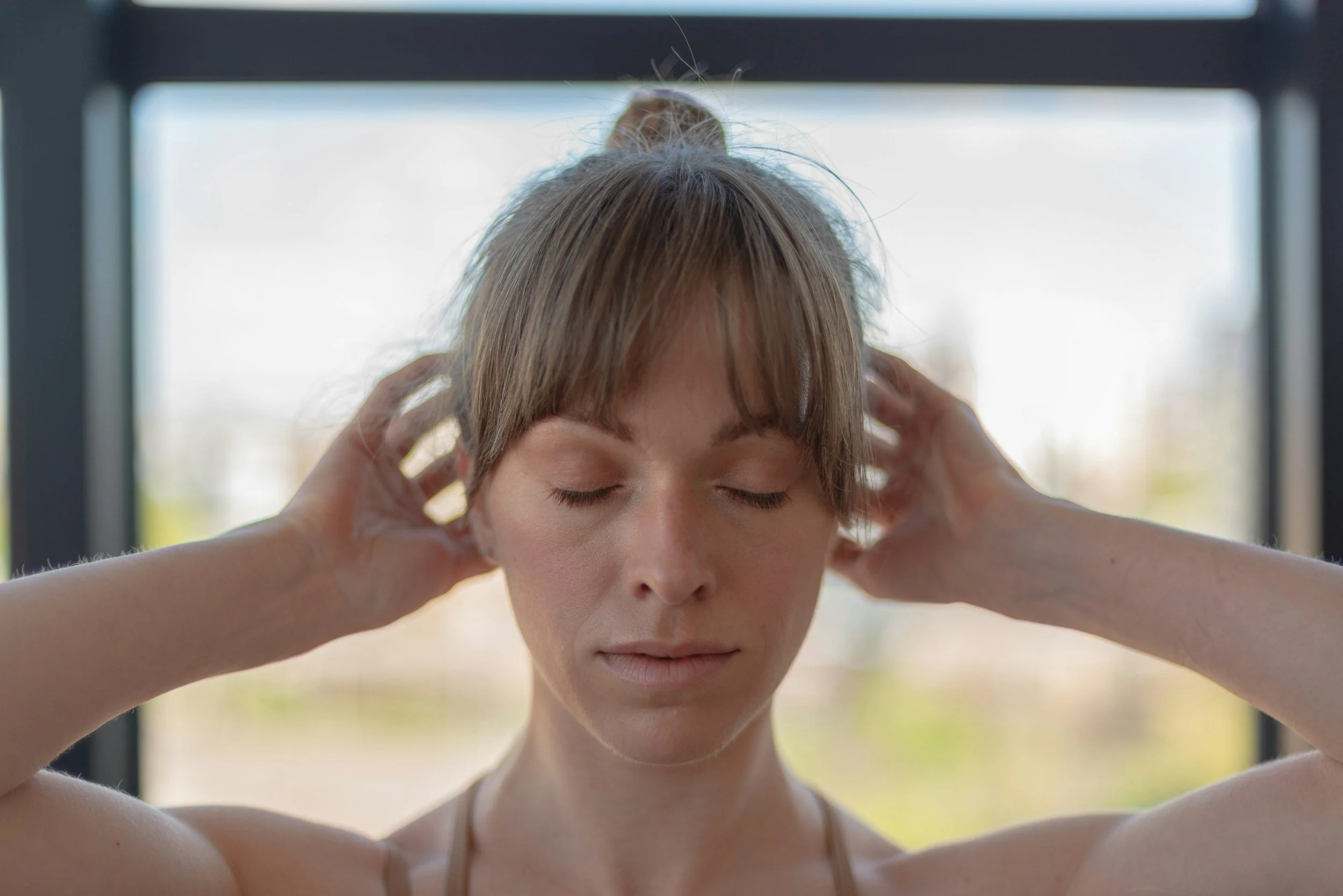 women massaging head