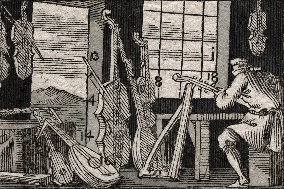 A black and white drawing of a figure sitting at a desk with multiple musical instruments around, including a guitar, and music sheets on a stand.