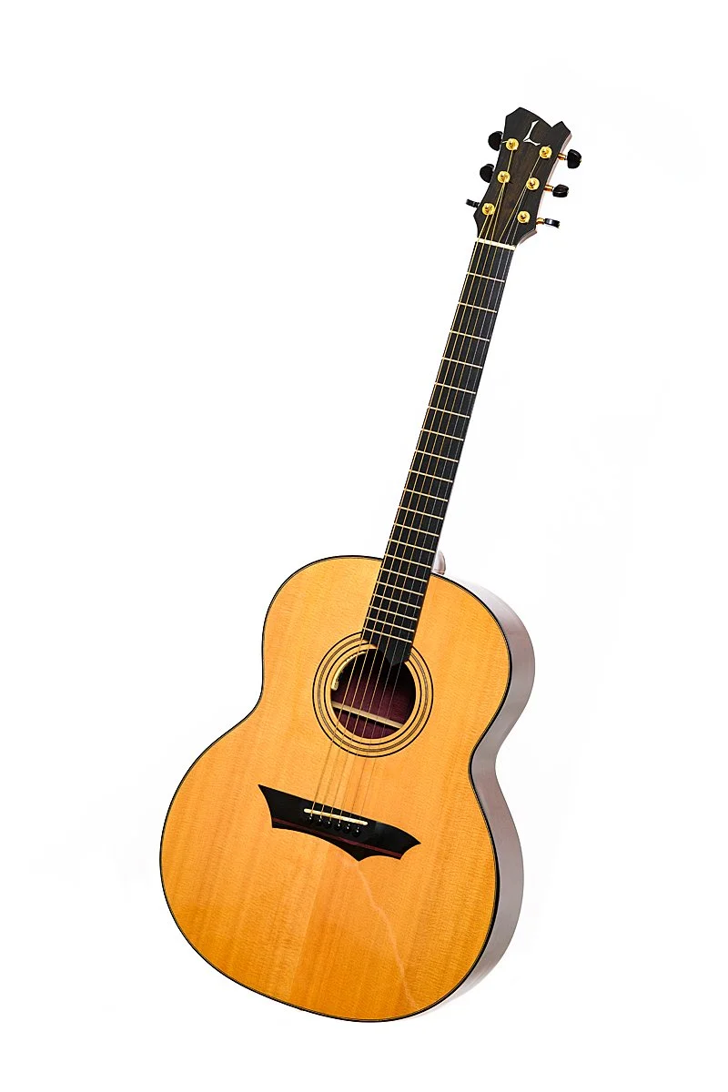 An acoustic guitar with a natural wood finish, six strings, and black tuning pegs, isolated on a white background.