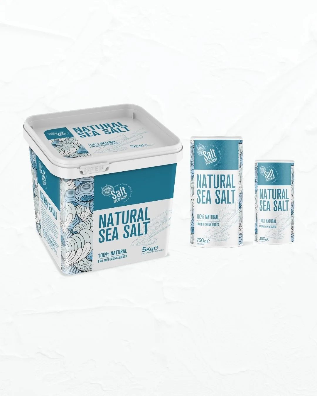 Packaging of natural sea salt including a five-kilogram box and two smaller containers of 750 grams and 350 grams, all with blue and white design and labels.