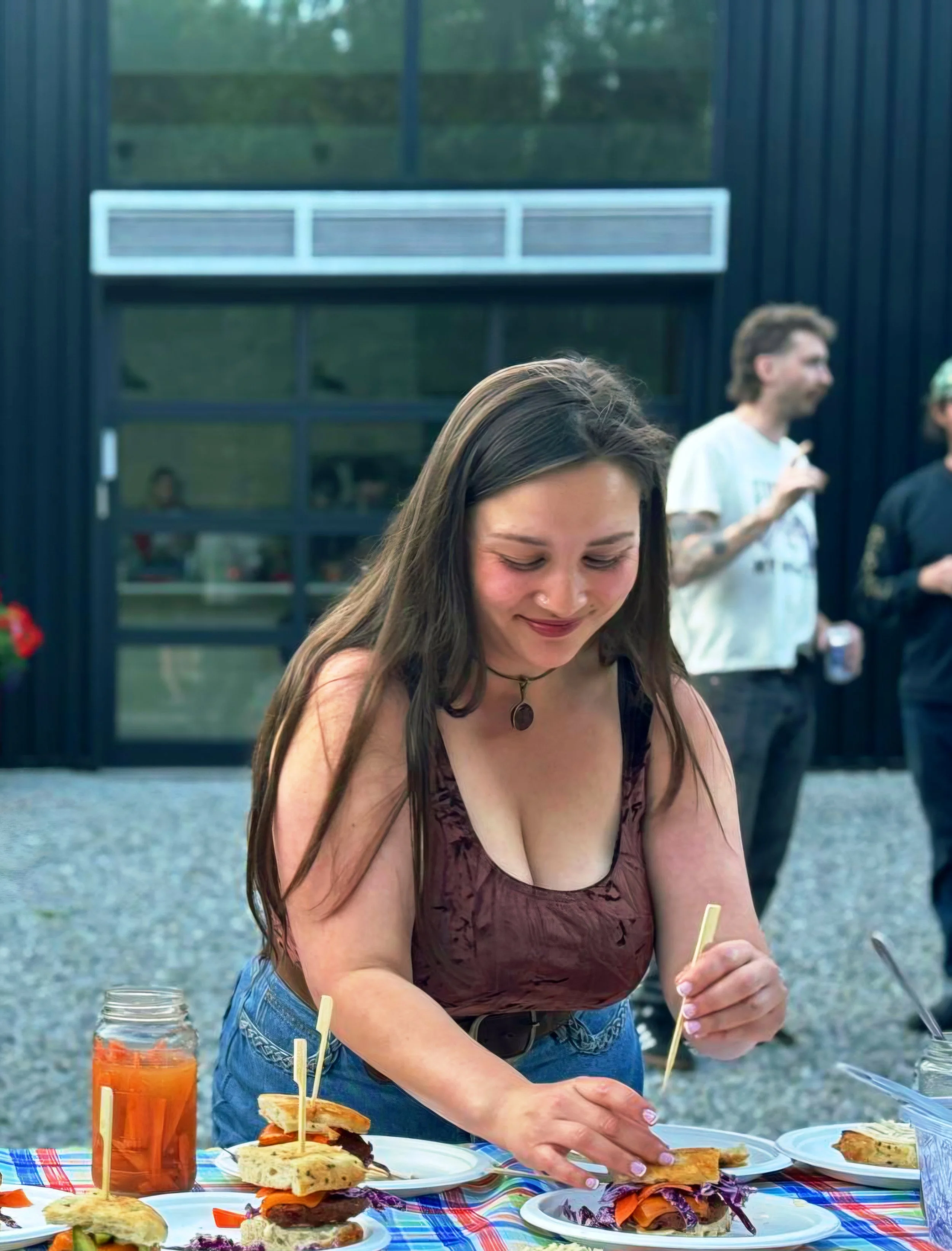 Jess from Manami's kitchen preparing vegetarian Japanese- inspired street food at an outdoor event