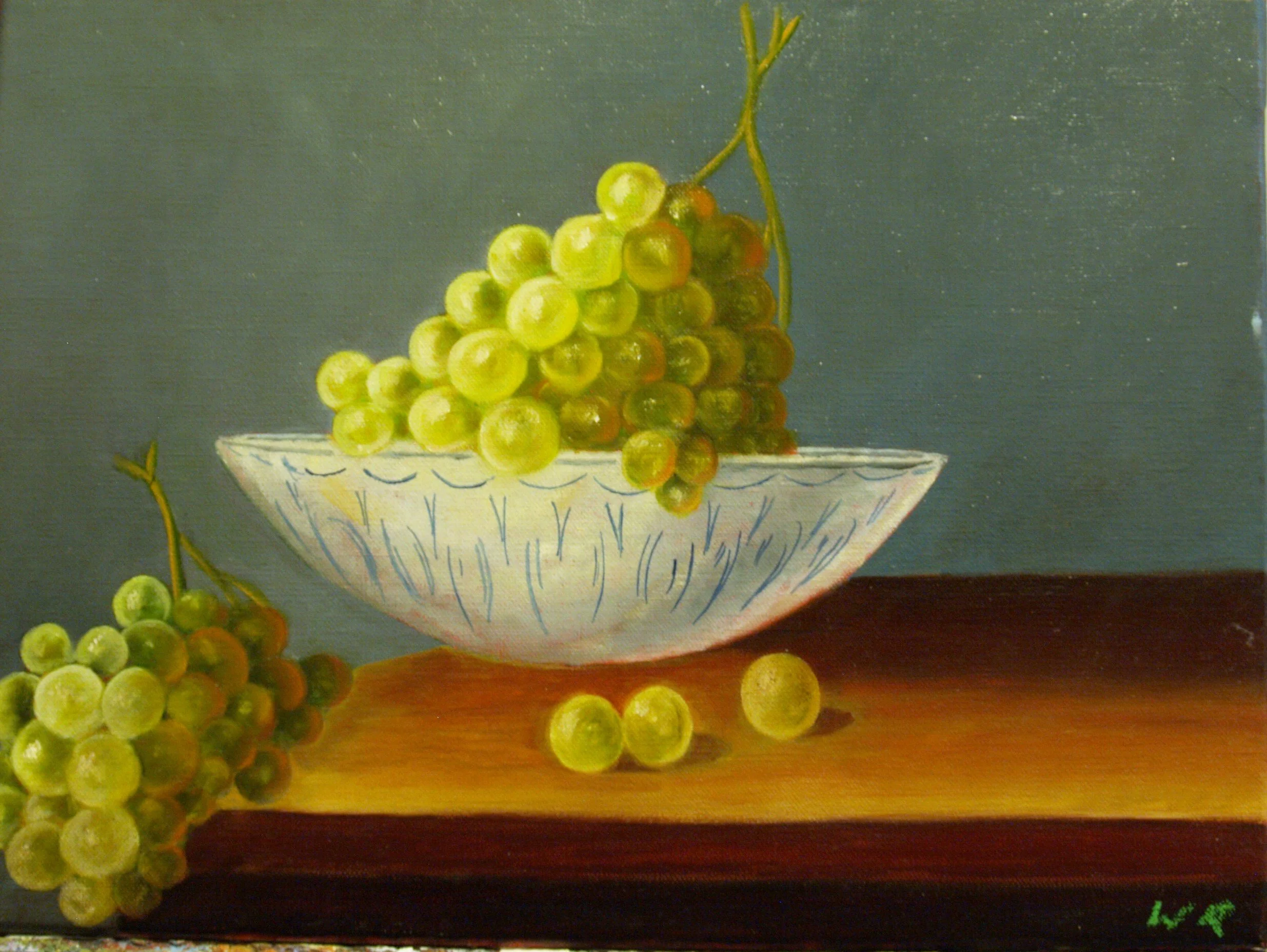 A painting of green grapes in a decorative white bowl on a wooden surface, with some grapes spilling out beside the bowl.