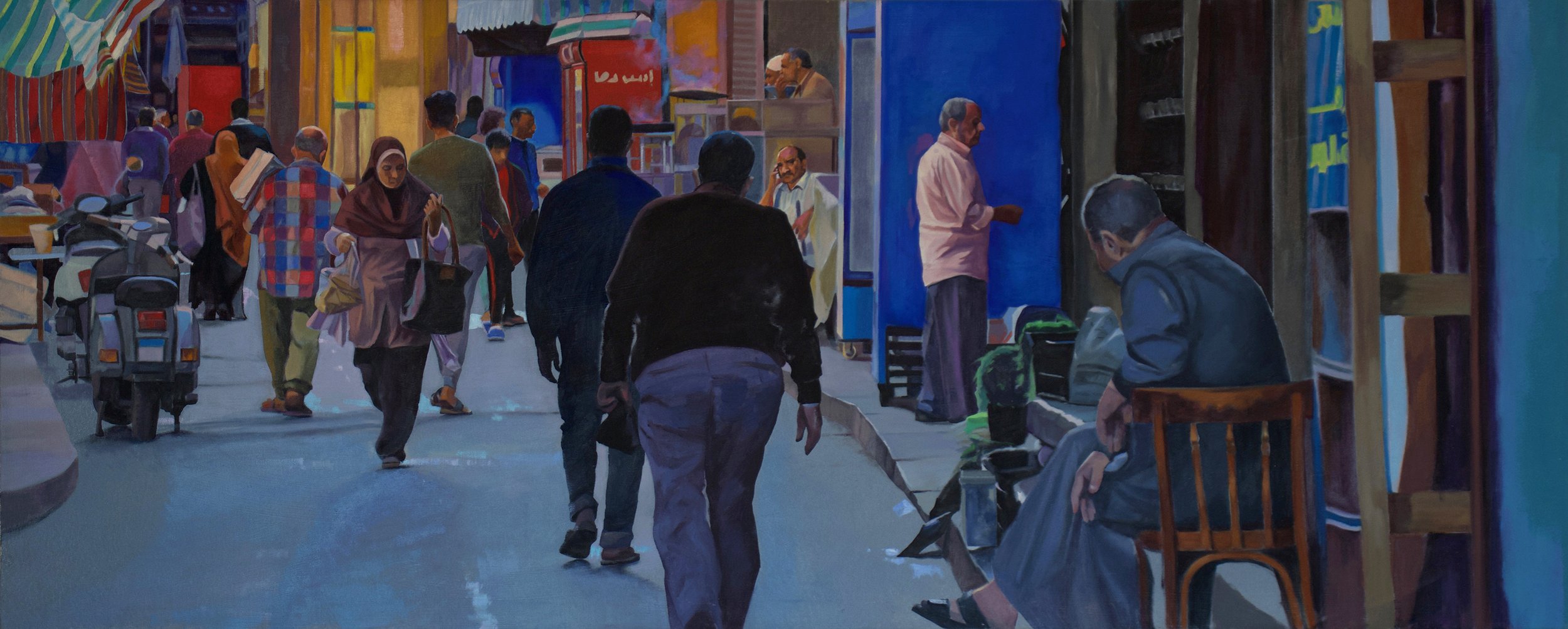 A busy street scene at dusk with pedestrians walking past various storefronts and vendors. Some people are seated, while others are standing or walking, surrounded by vibrant colors and signs.