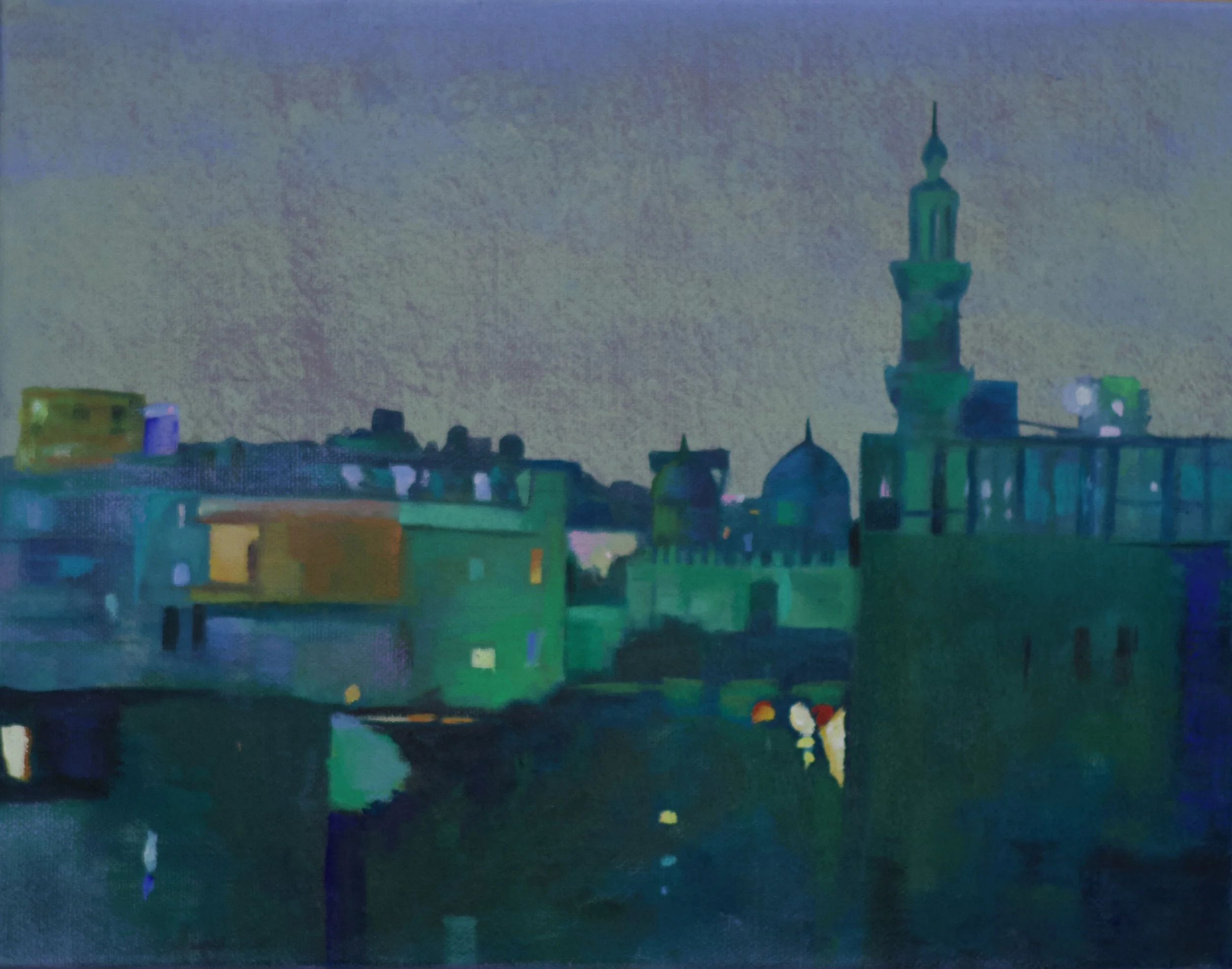 A city skyline at dusk or night with various buildings and a tall tower, featuring colorful lighting and a cloudy sky.