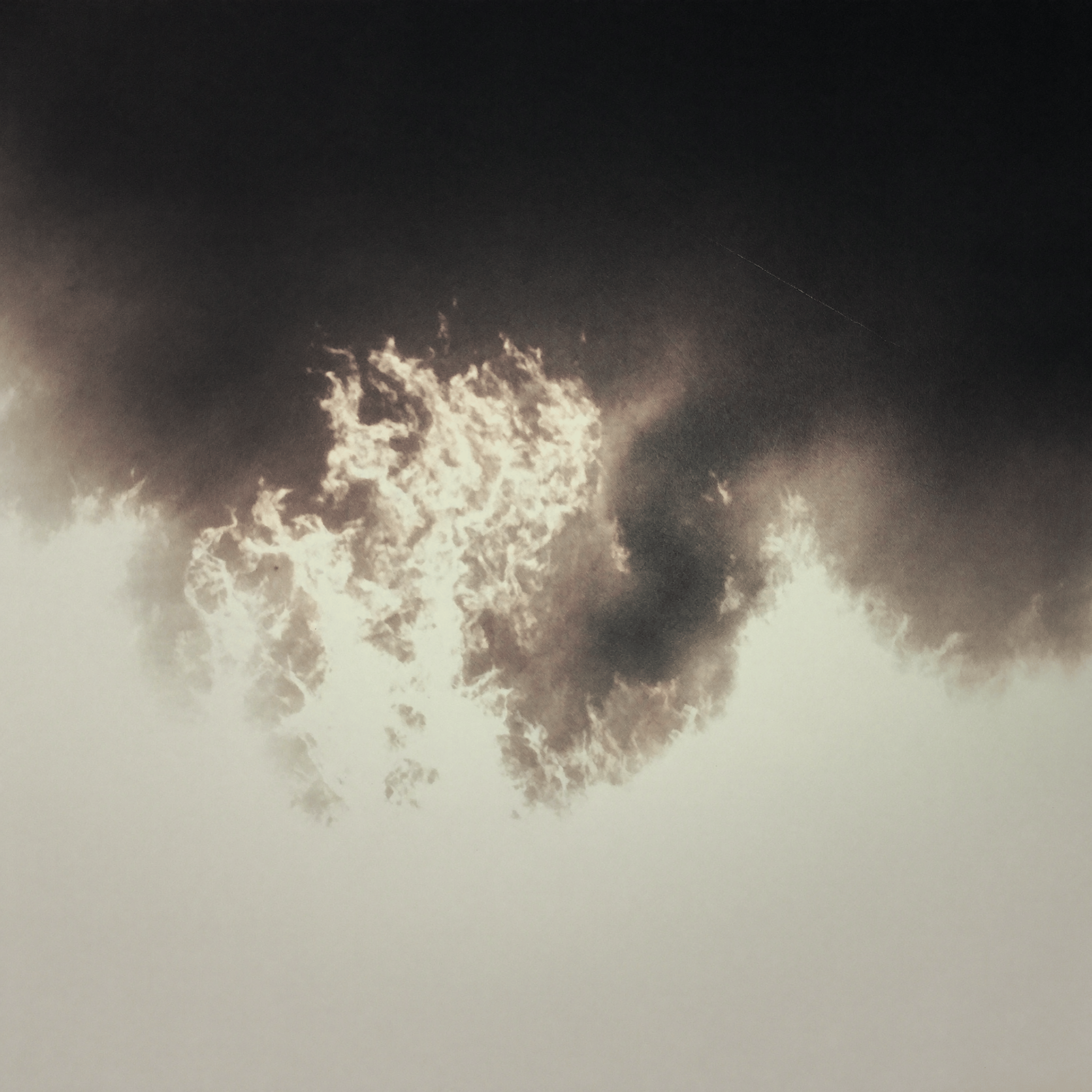 Night sky with a bright moon and scattered clouds, some illuminated by moonlight.