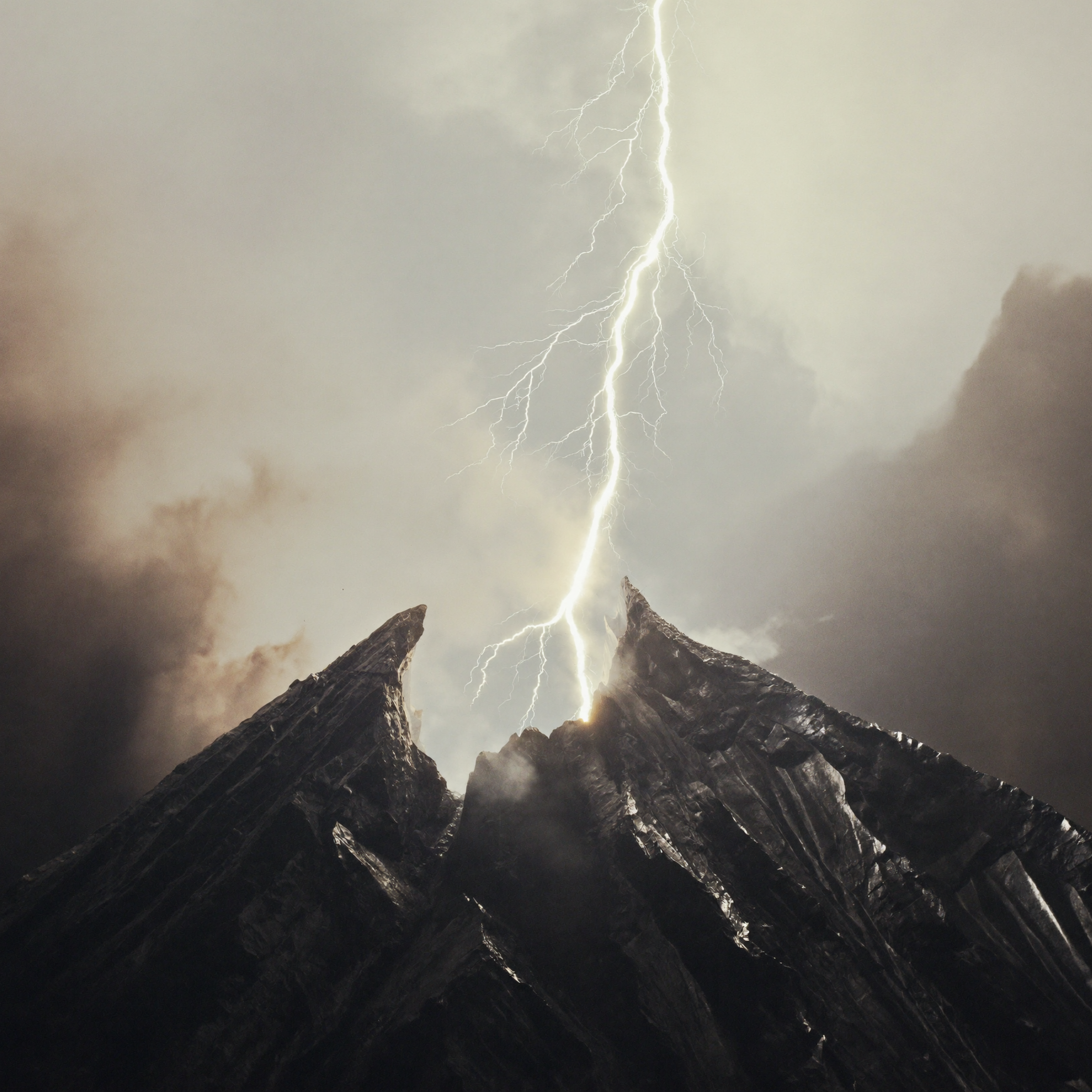 Lightning strikes over snow-covered mountain peaks during a stormy night.