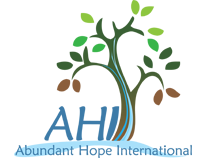 A stylized illustration of a person standing on a boat with water, trees, and a mountain in the background. Contains text that reads 'Abundant International'.