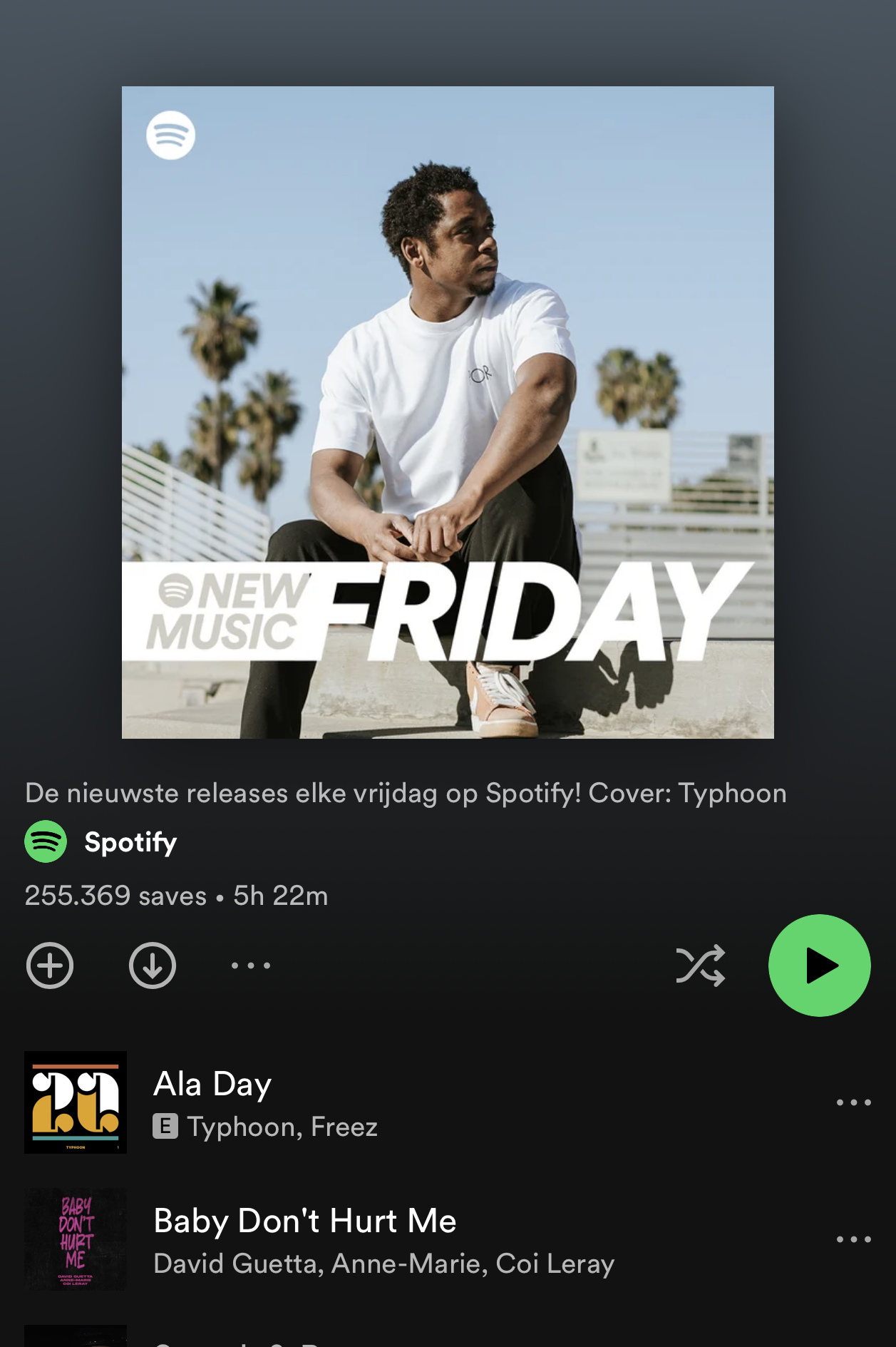 A person sitting outdoors on bleachers with palm trees and a blue sky in the background, wearing a white t-shirt and black pants, promoting new music releases on Spotify every Friday.