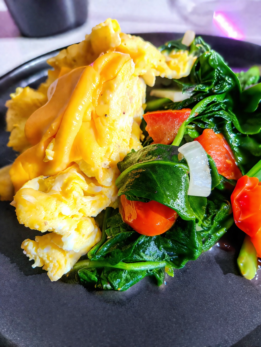 Vibrant breakfast on a dark plate.png