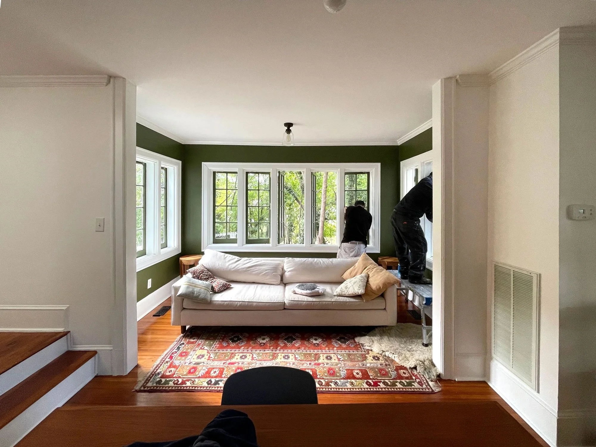 The details always matter. Two team members putting the final touches on a fantastic sun room.