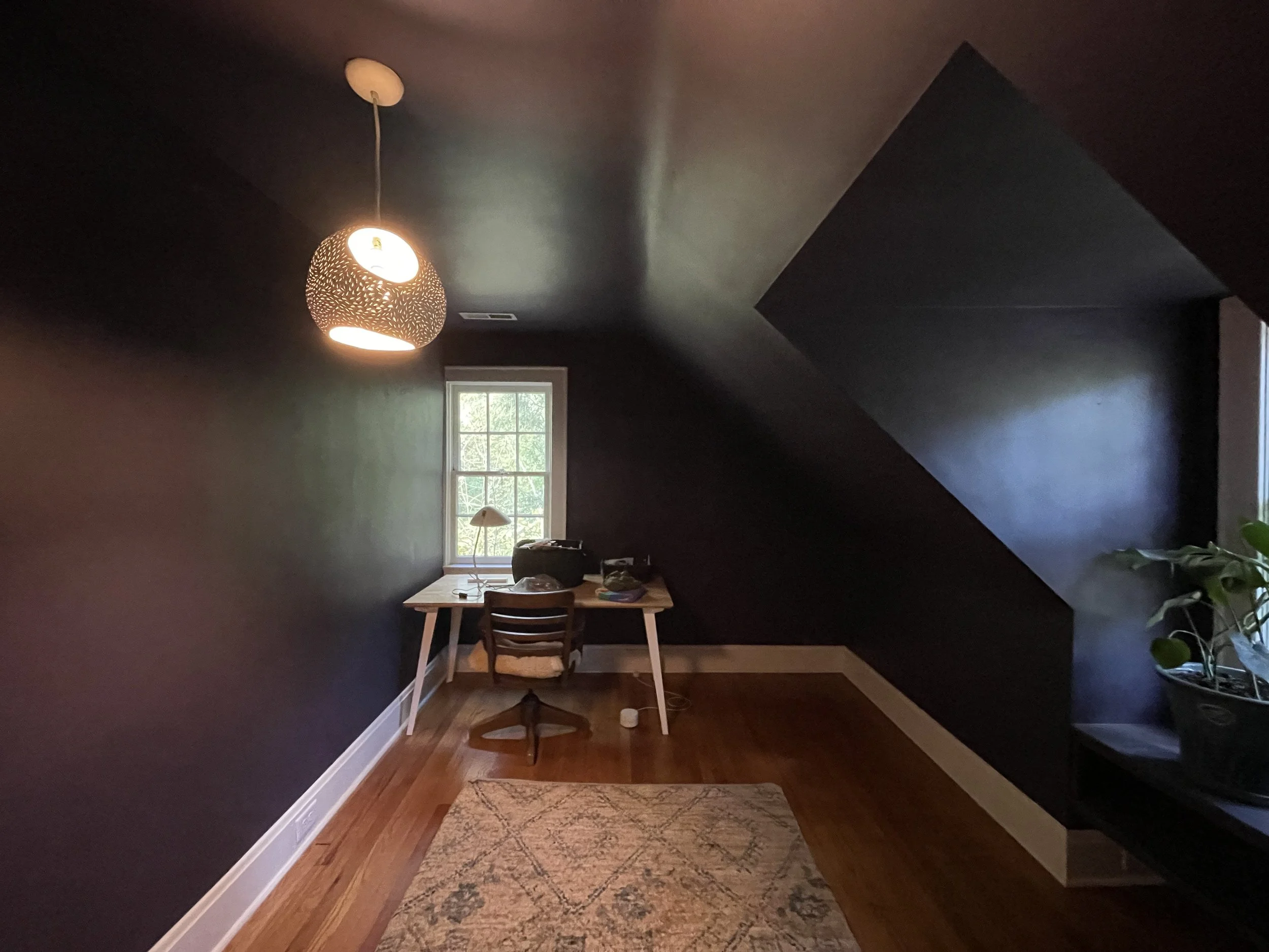 No work distractions when you have a dimly lit office with dark walls.