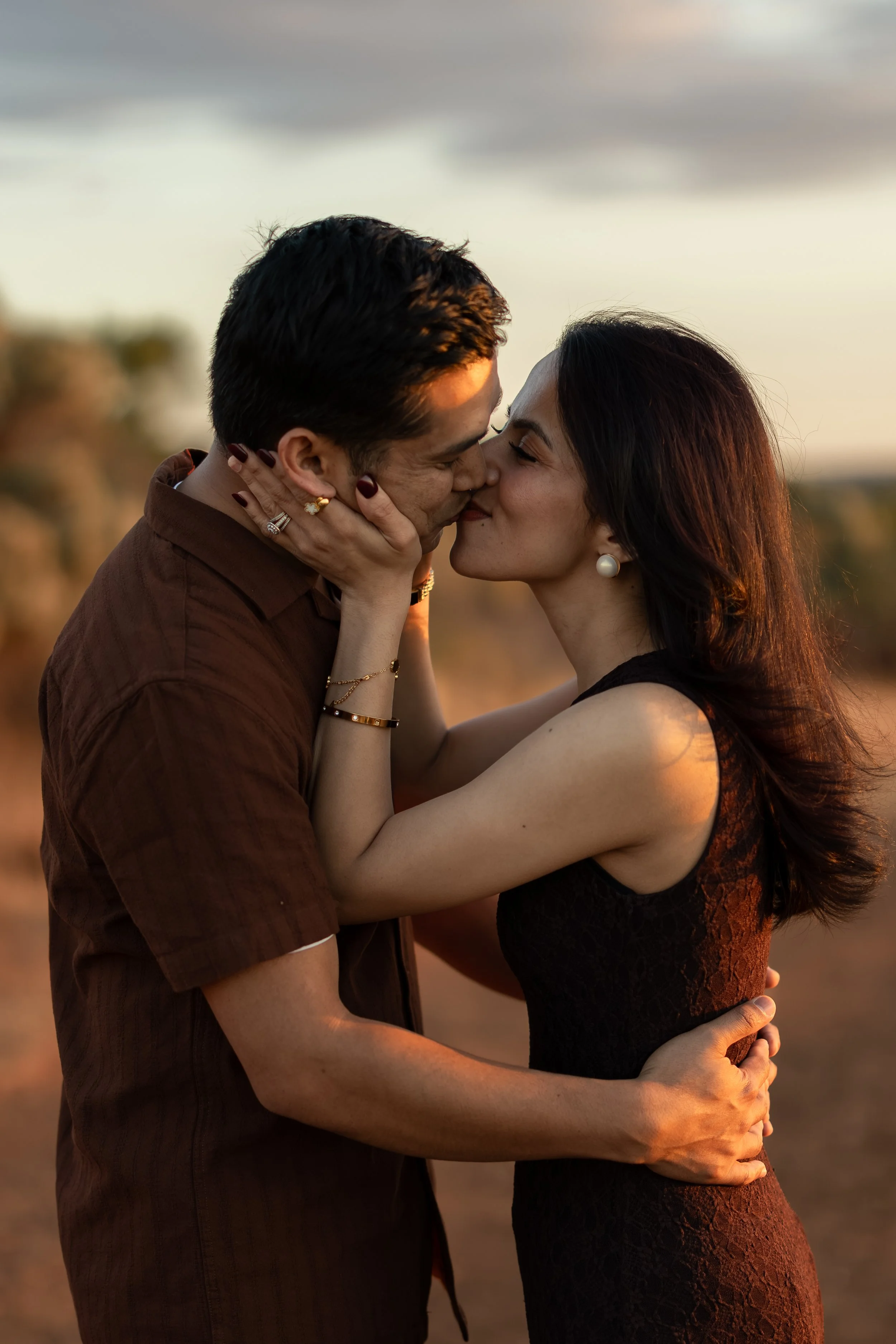 Couple kissing at sunset during a couples photography session in Adelaide.