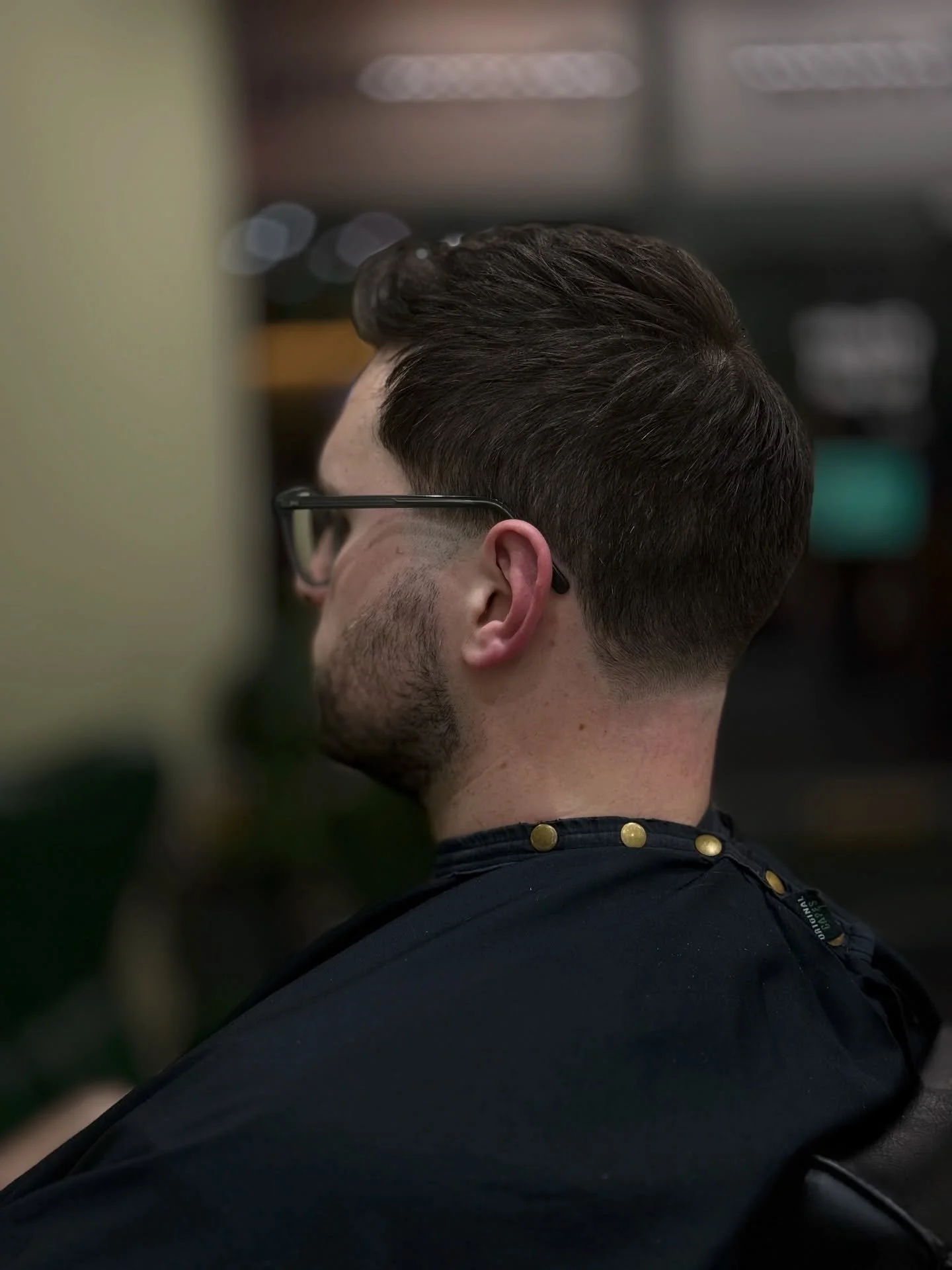 TAPER // gradually shortens hair length at the temples and nape, leaving longer hair on top and sides for a subtle, professional, and low-maintenance style.
