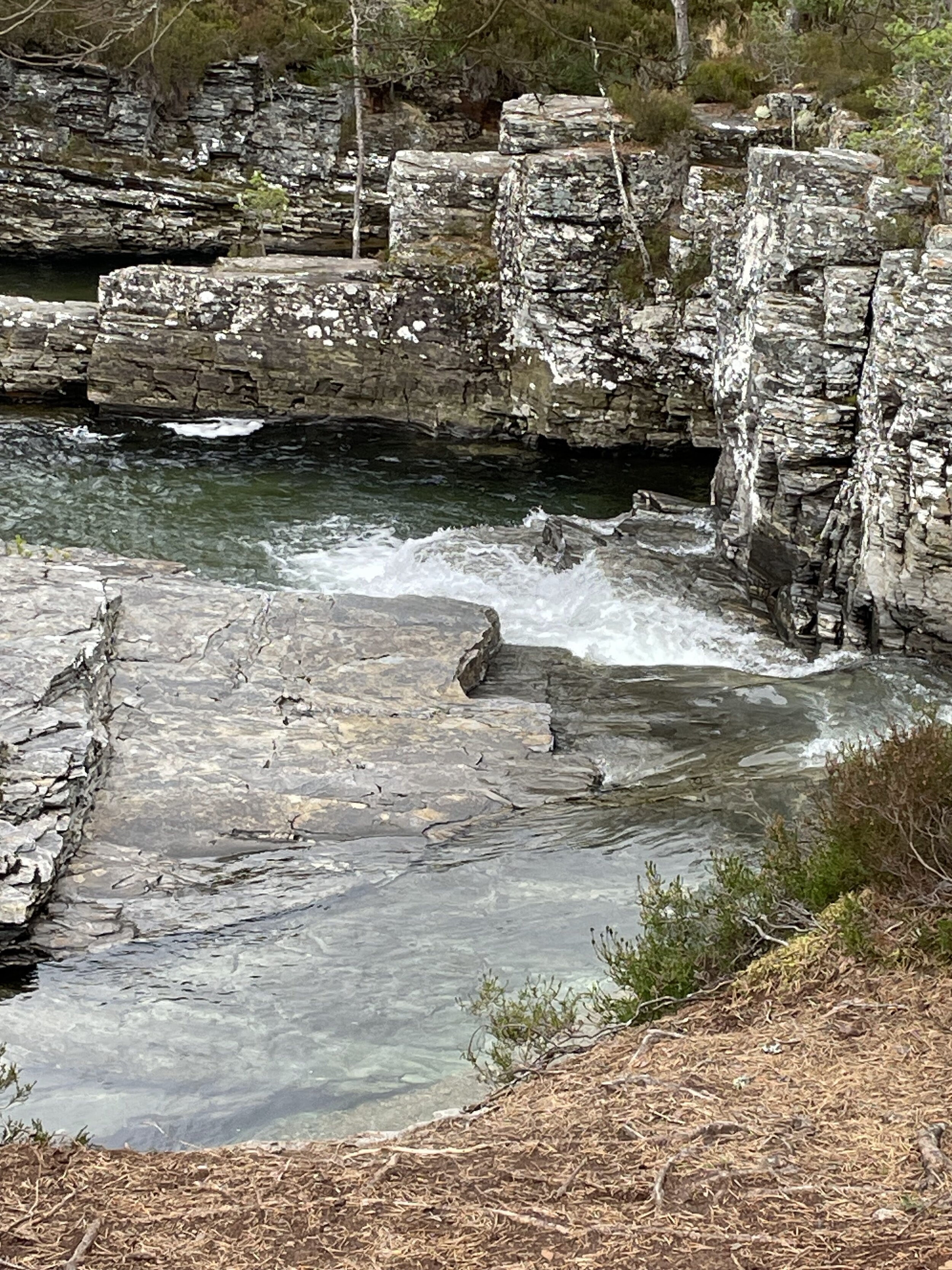 image of a river carving through granite rock faces