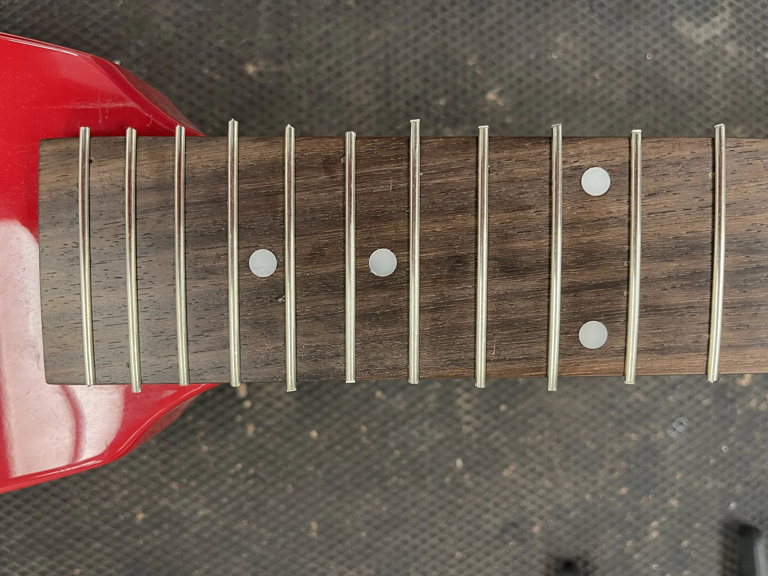 Refret- All frets in and ready to cut.