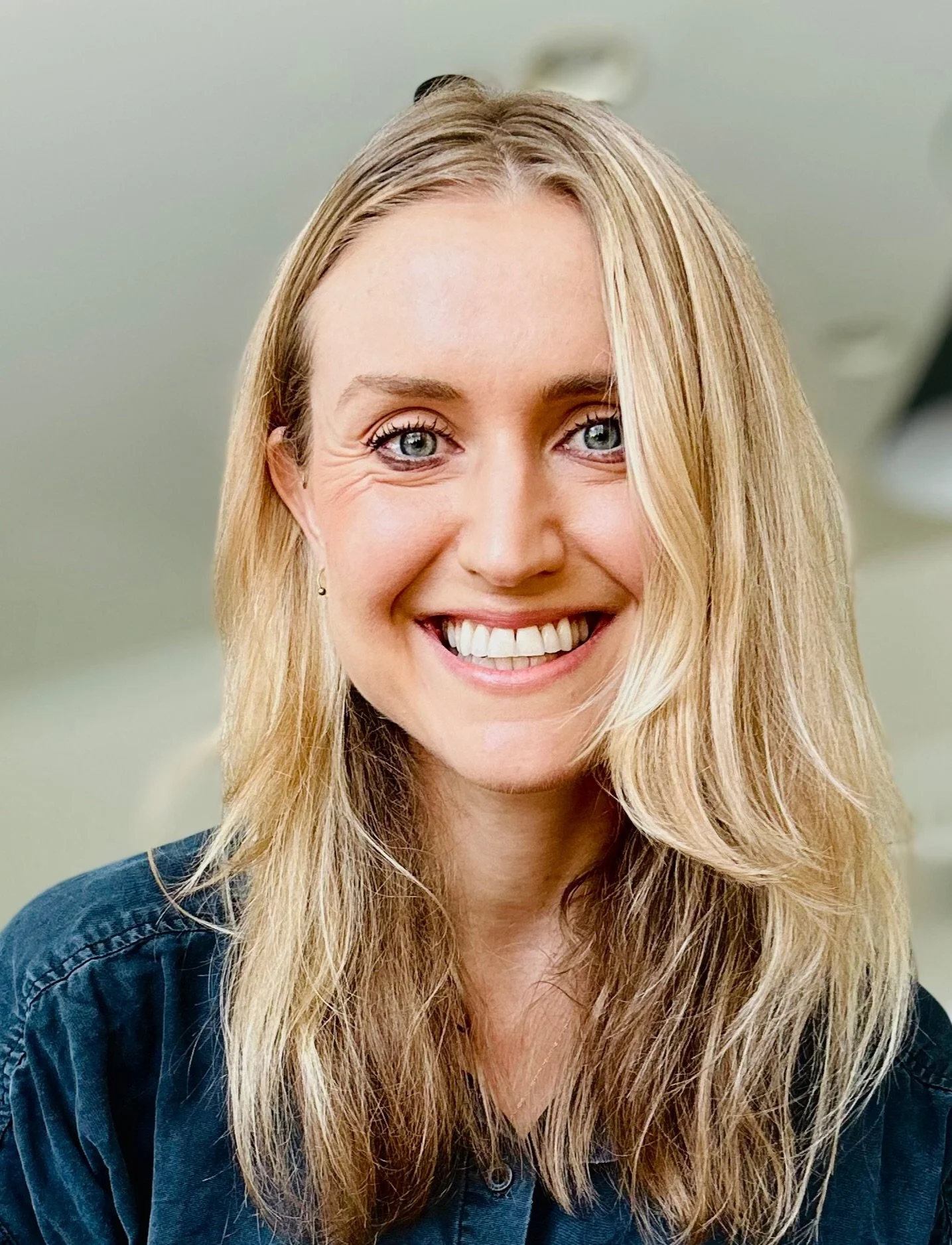 Tiffany Pecoraro, Registered Dietitian, smiling in a dark denim top