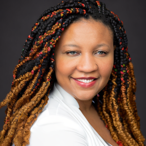 Danielle Boose-McDowell, Licensed Professional Counselor, smiling wearing a white top