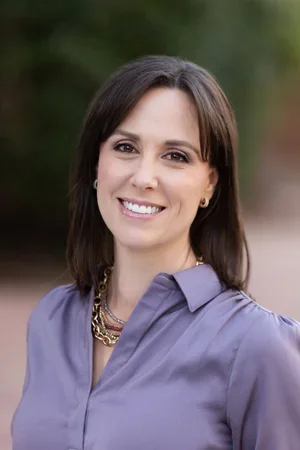 Shana Evans Basset, Licensed Professional Counselor, smiling wearing a lavender blouse and a gold chain necklace