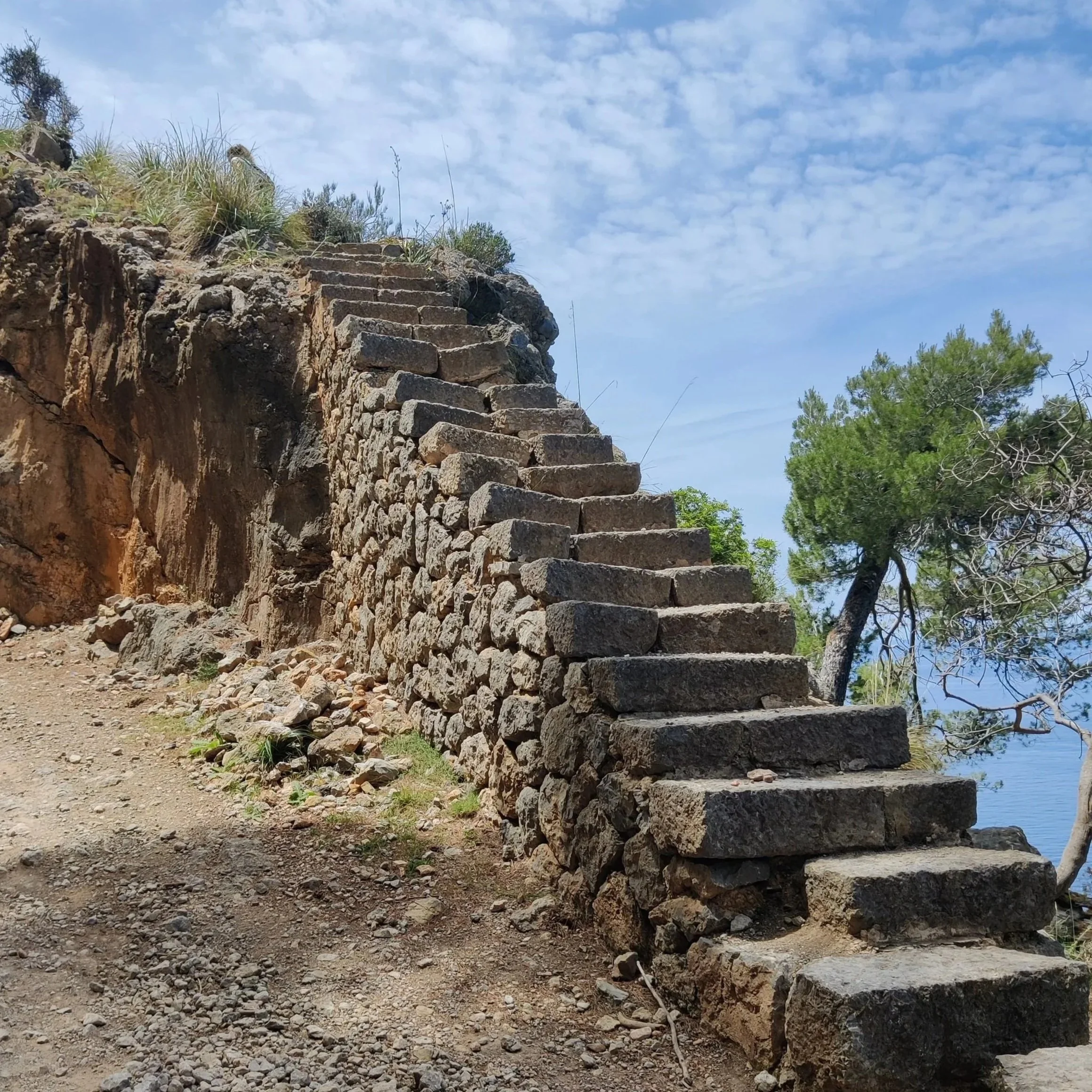 Stone path through the Serra de Tramuntana, Mallorca — natural setting for a wellness reset