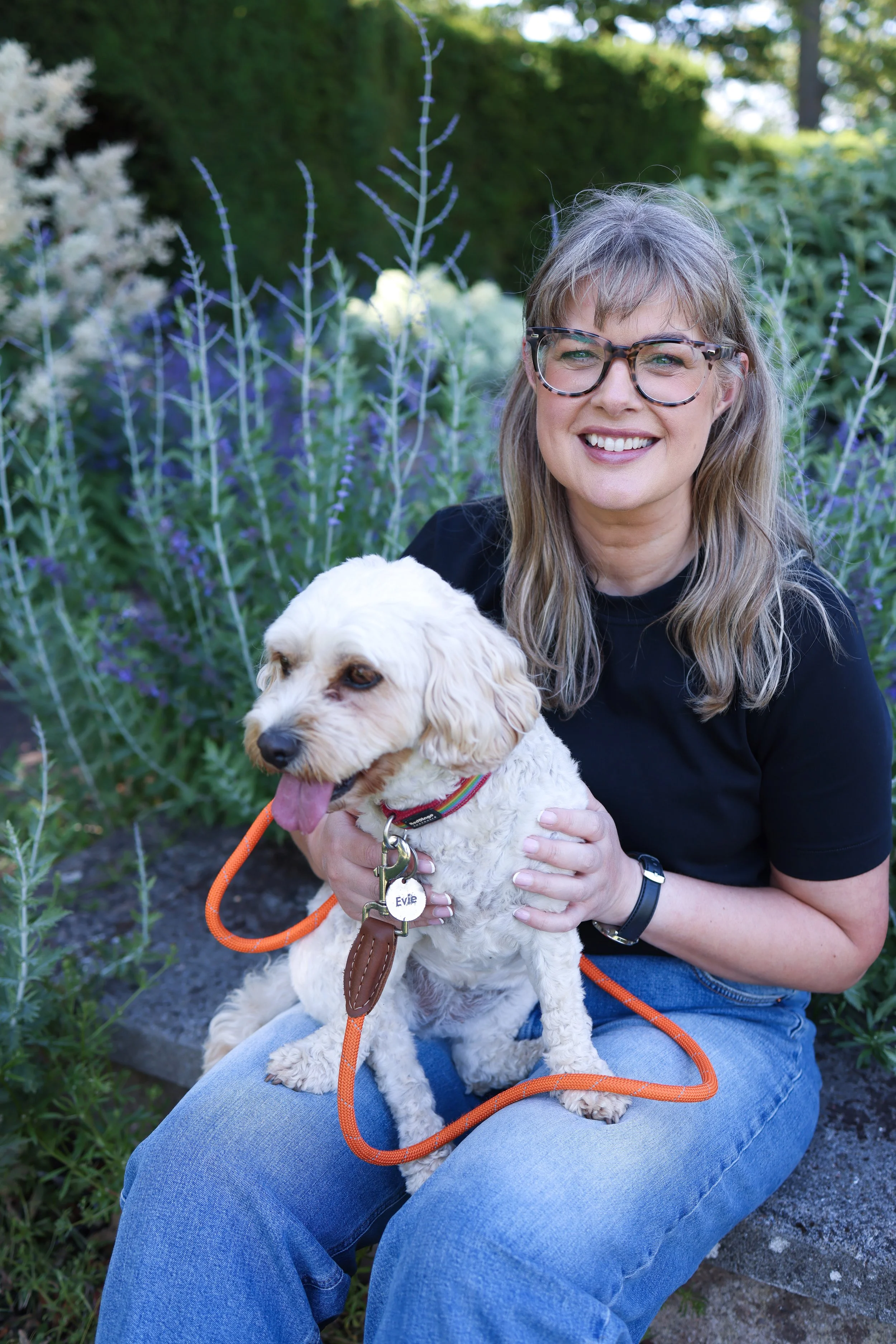 sarah stewart with her dog Evie smiling to camera