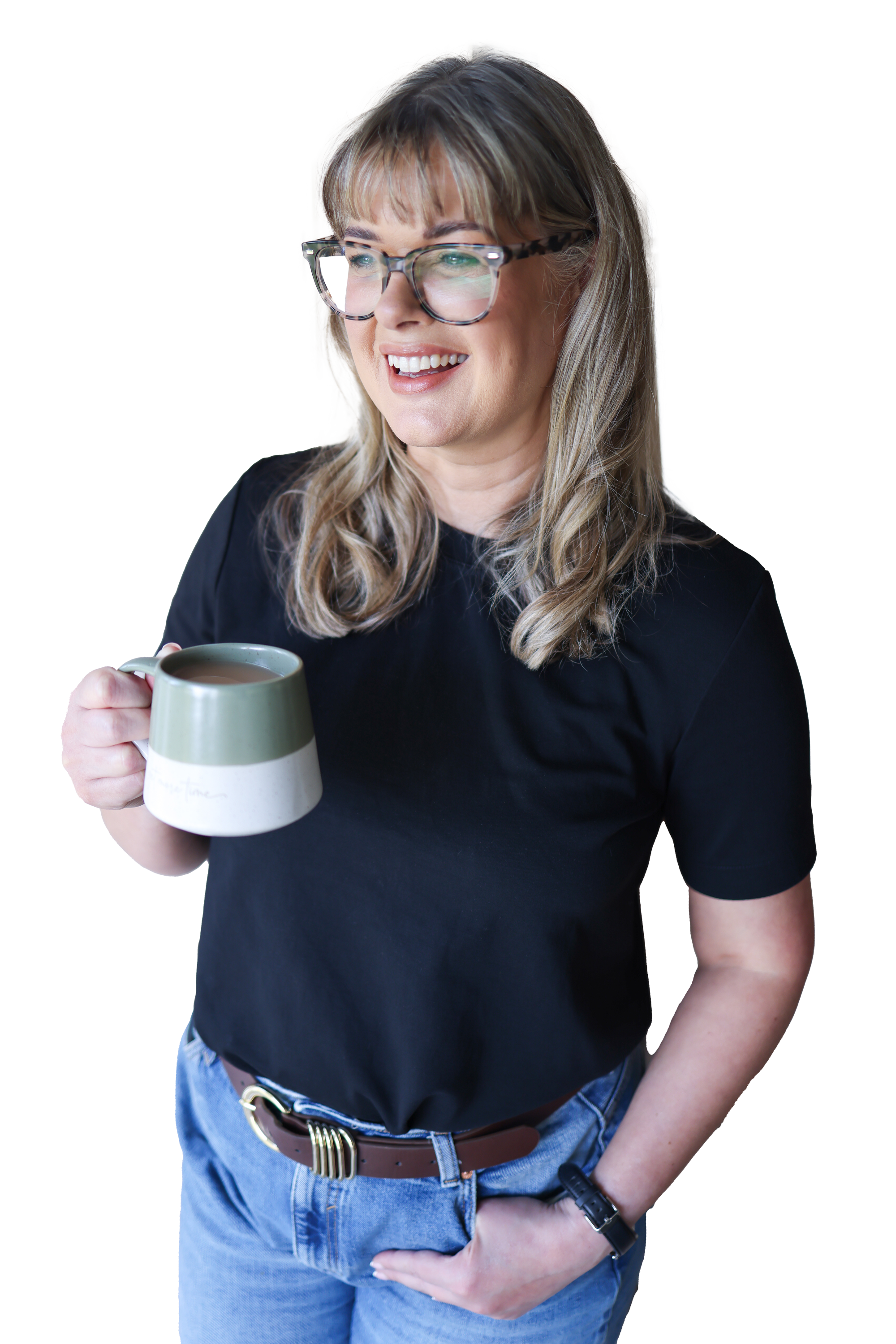 A woman with long blonde hair, wearing glasses and a black t-shirt, smiling while holding a mug of coffee or tea.