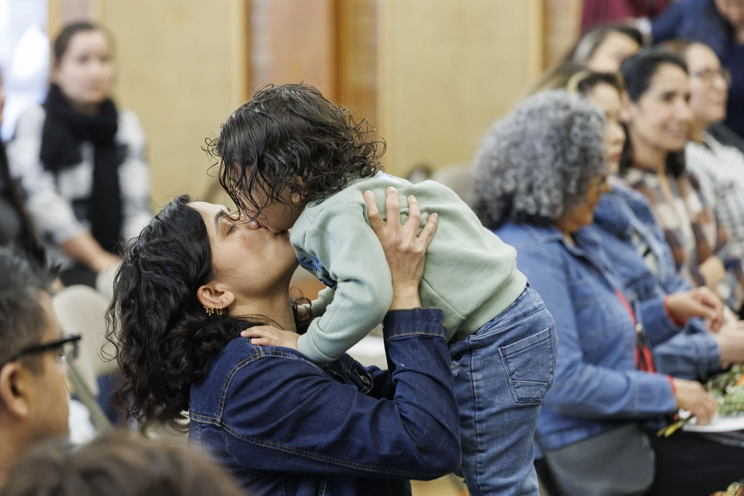 Mom kissing her baby