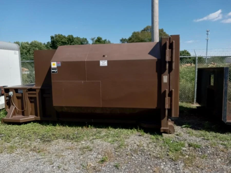 USED SELF CONTAINED COMPACTOR