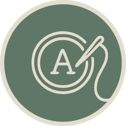 Illustration of an embroidery hoop with the letter A being stitched.