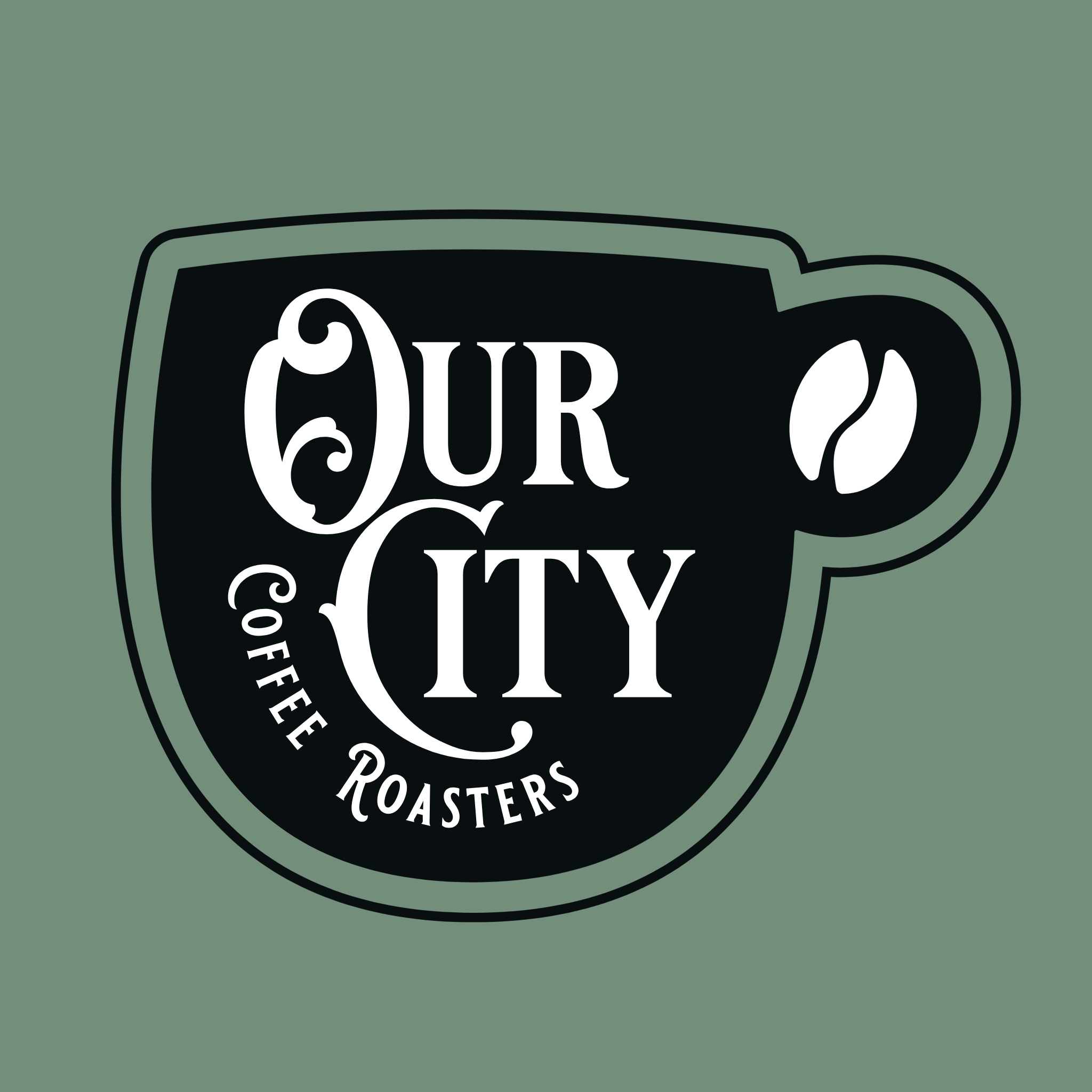 A black coffee mug with white text that reads "OUR CITY" on a solid green background.