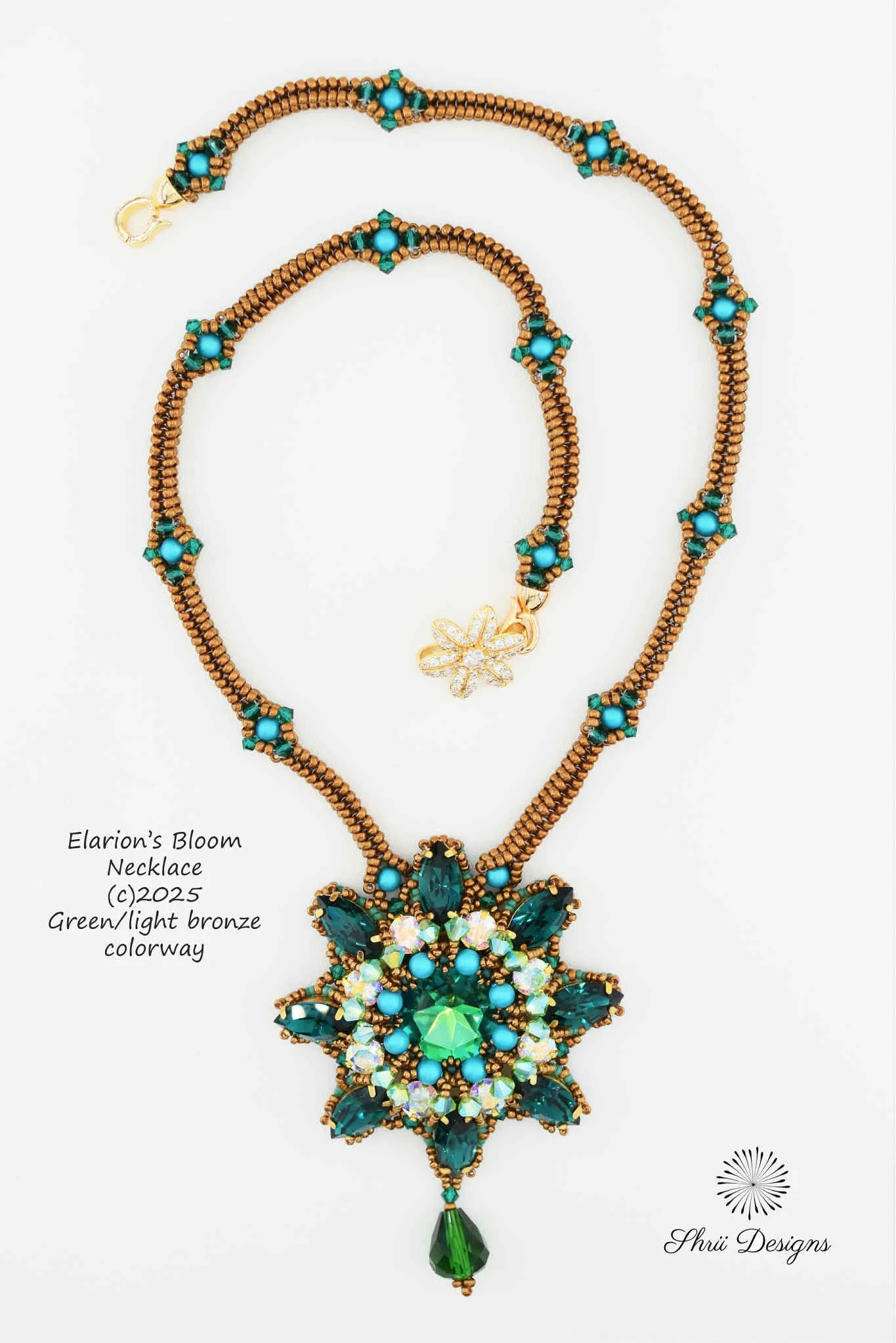 A detailed, multi-colored necklace with blue, green, and gold beads, prominently featuring a large, floral-inspired pendant with sparkling gemstones and a green teardrop charm at the bottom. The necklace is labeled as 'Elarion's Bloom Necklace, copyr