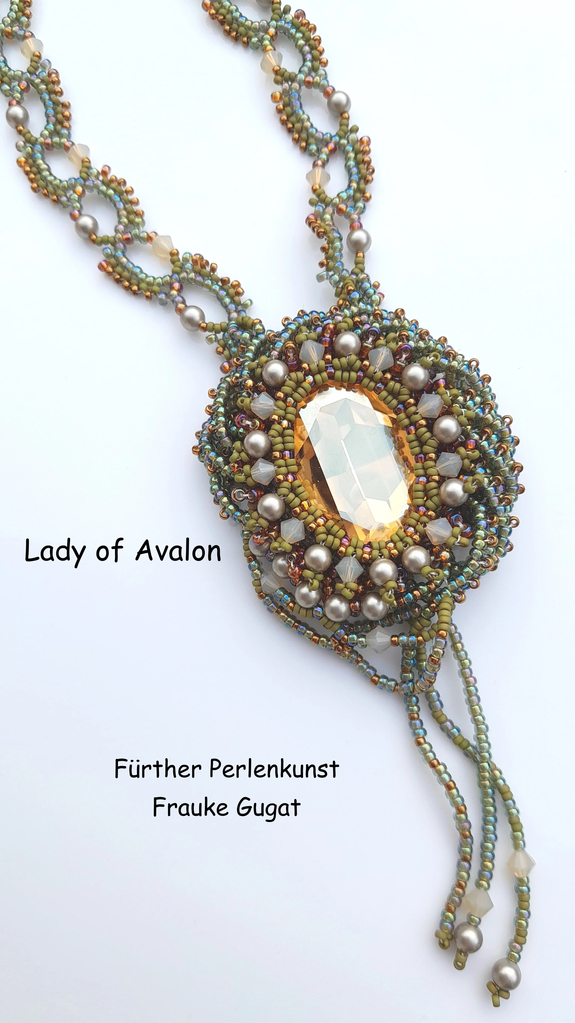 Beaded necklace with a large central pendant made of a faceted oval crystal surrounded by smaller beads, pearls, and seed beads in earthy tones, with multiple strands of beads hanging from the pendant.