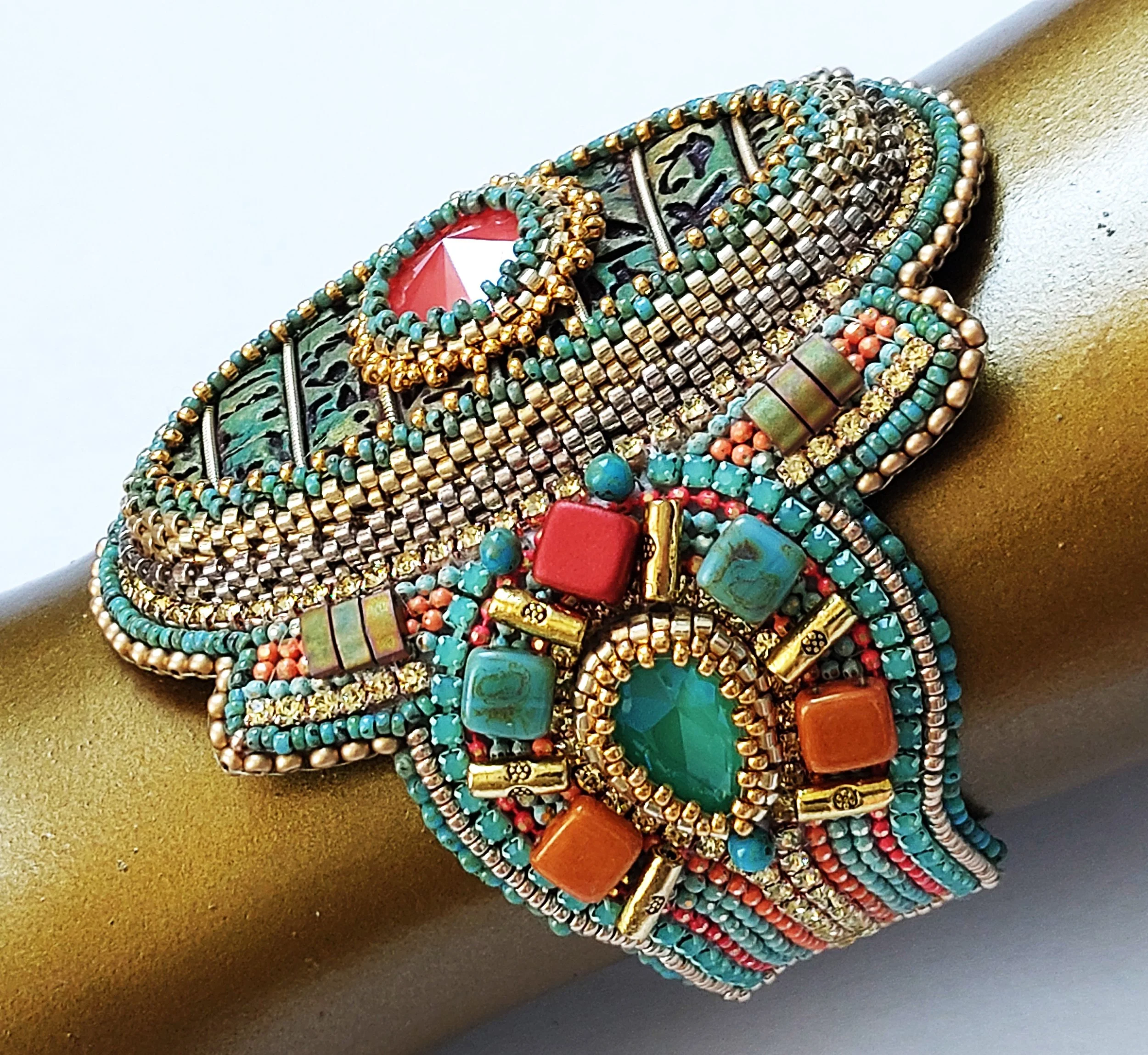 Colorful beaded turquoise, red, gold, and silver jewelry bracelet.