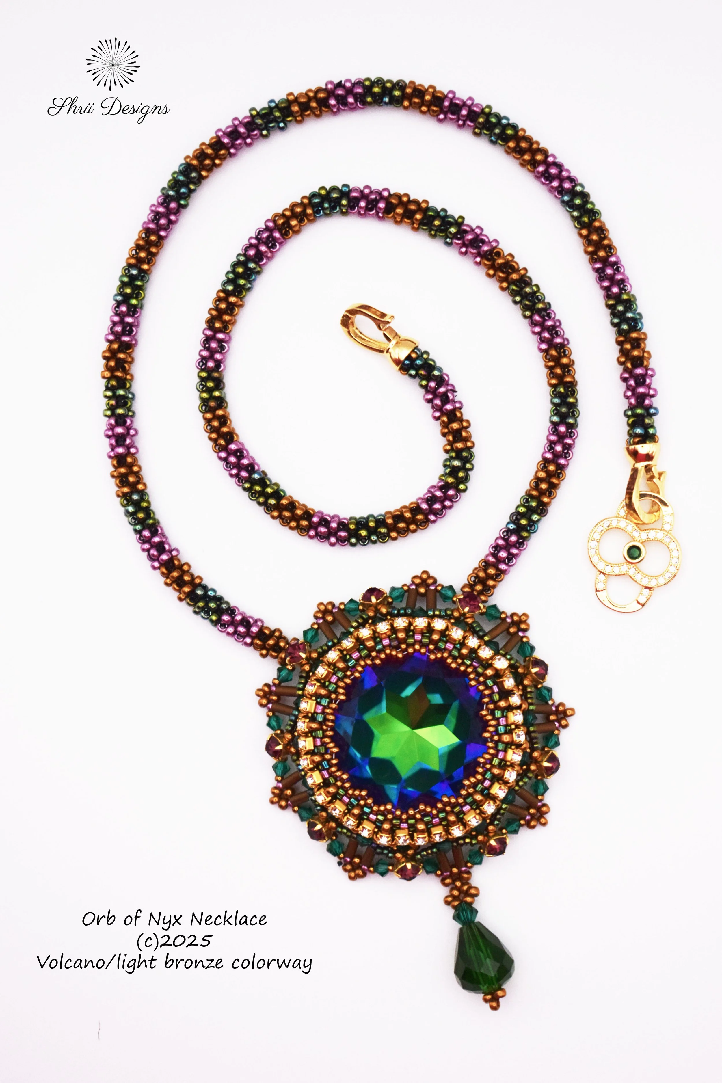 Beaded necklace with a large central green and blue gemstone, surrounded by multicolored beads, a gold clasp, and a green pendant at the bottom. The image includes the text 'Orb of Nyx Necklace' and notes the design's copyright and color details.