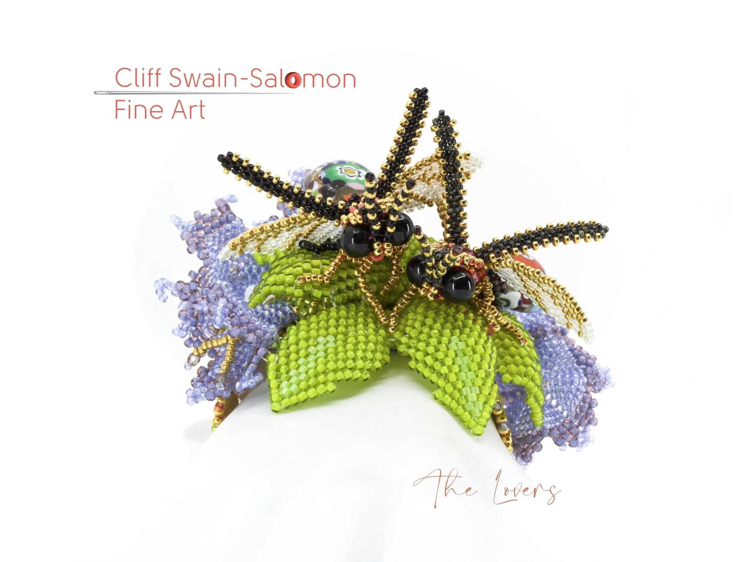 A colorful beaded jewelry piece arranged in the shape of a floral bouquet with green leaves, purple and blue blossoms, and a black and gold butterfly accent, set against a white background.