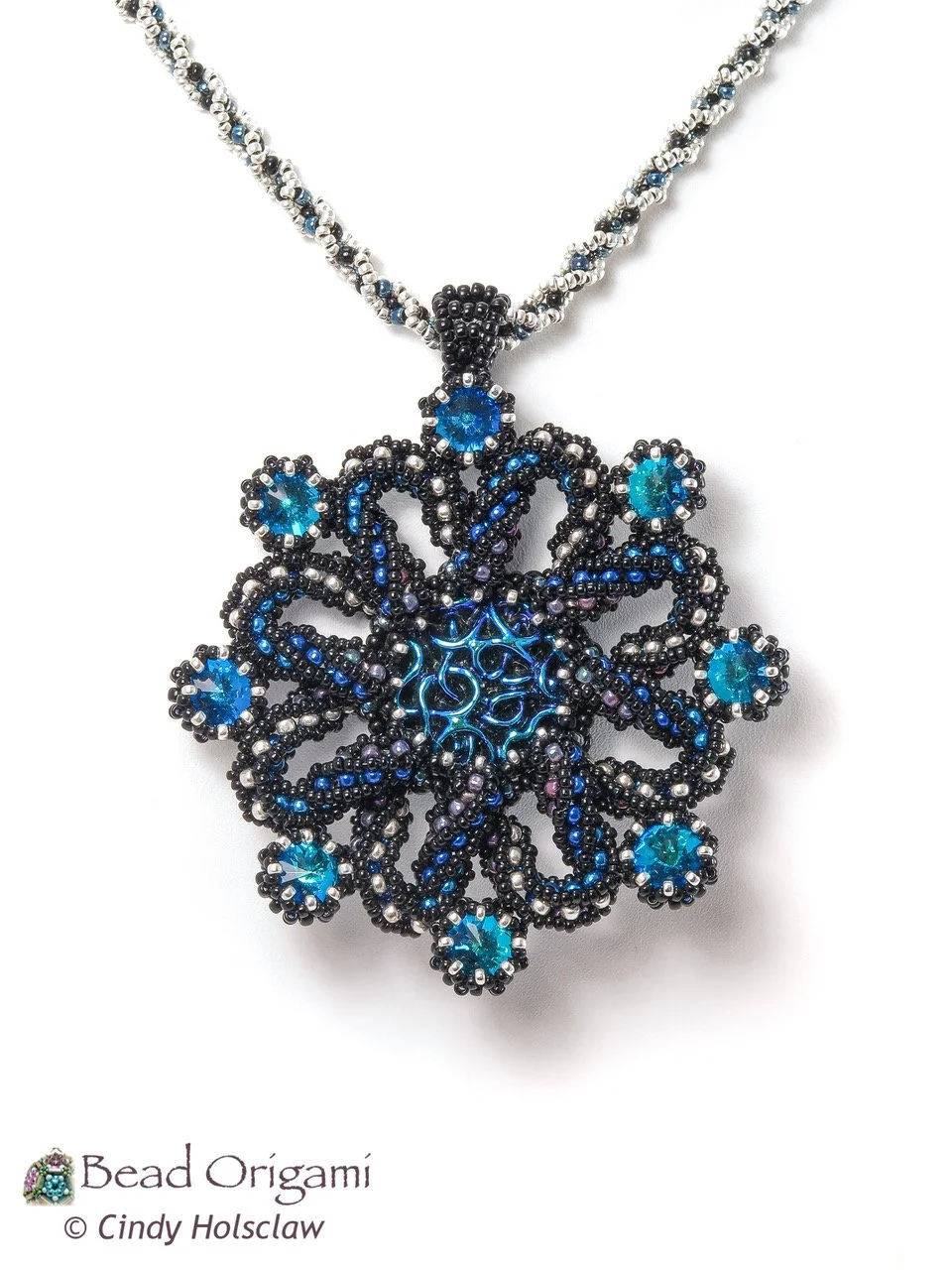 Beaded octopus-shaped pendant with blue and black beads on a silver chain