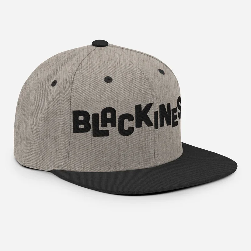 Merchandise design for a woven gray and black flat-brim hat with 'BLACKINESE' embroidered in black letters on the front, matching the style of the book cover design.