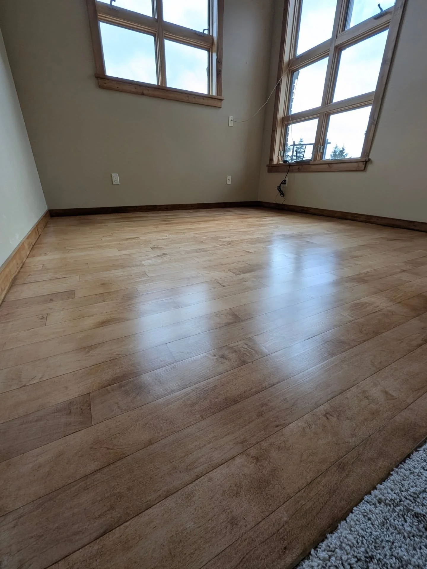 When this client approached me about turning their office into a yoga room, I didn't think this little 10x10 solid maple flooring project would turn into quite the challenge. Between a heated slab underneath preventing stapling, needing a fully flush