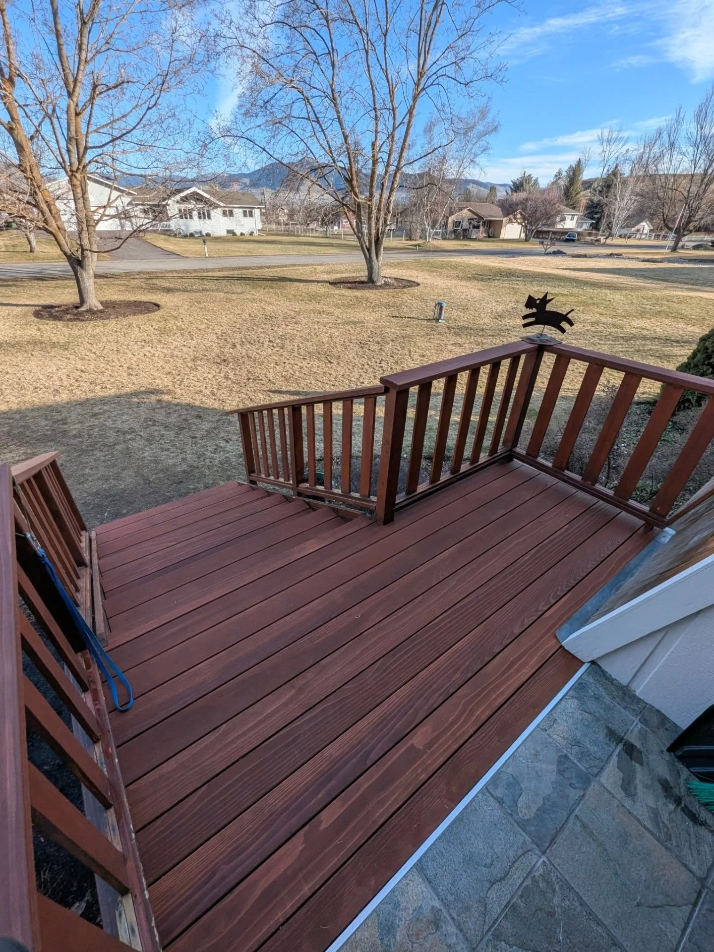 Another day, another deck. Redwood with Sequoia flavored outdoor stain. The customer wanted to reuse the old railings, but we did add a new top handrail that won't fill your hands with splinters. Rebuilt the framing for the stairs as well, sort of a 