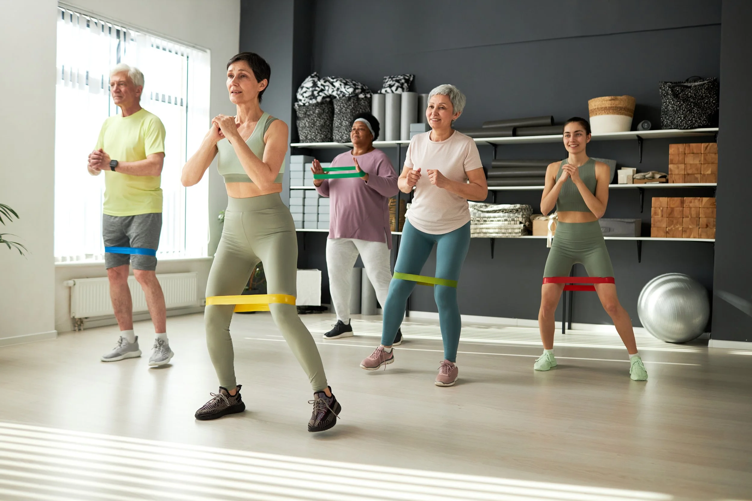 Elderly_People_Exercising_With_Rubber_Band_original_3045620.jpg