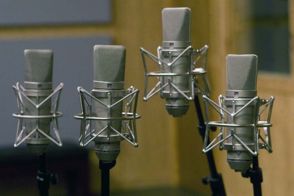 Close‑up of microphones and pro audio gear used for recording and mixing at SpectraSound LLC