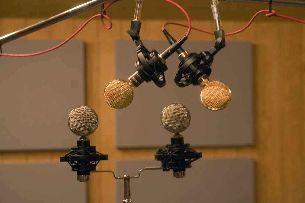 Close‑up of microphones and pro audio gear used for recording and mixing at SpectraSound LLC
