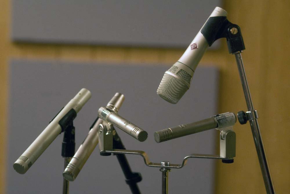 Close‑up of microphones and pro audio gear used for recording and mixing at SpectraSound LLC