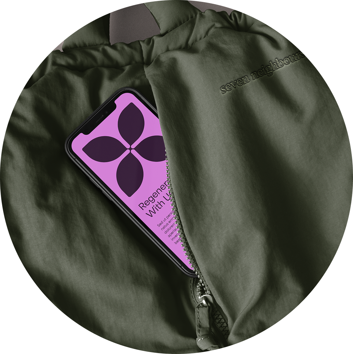 A green jacket with a partially unzipped pocket revealing a phone inside. The phone screen displays a purple logo with a flower shape and the text "Regen... With U...". The jacket has the embroidered brand name "seven neighbours".