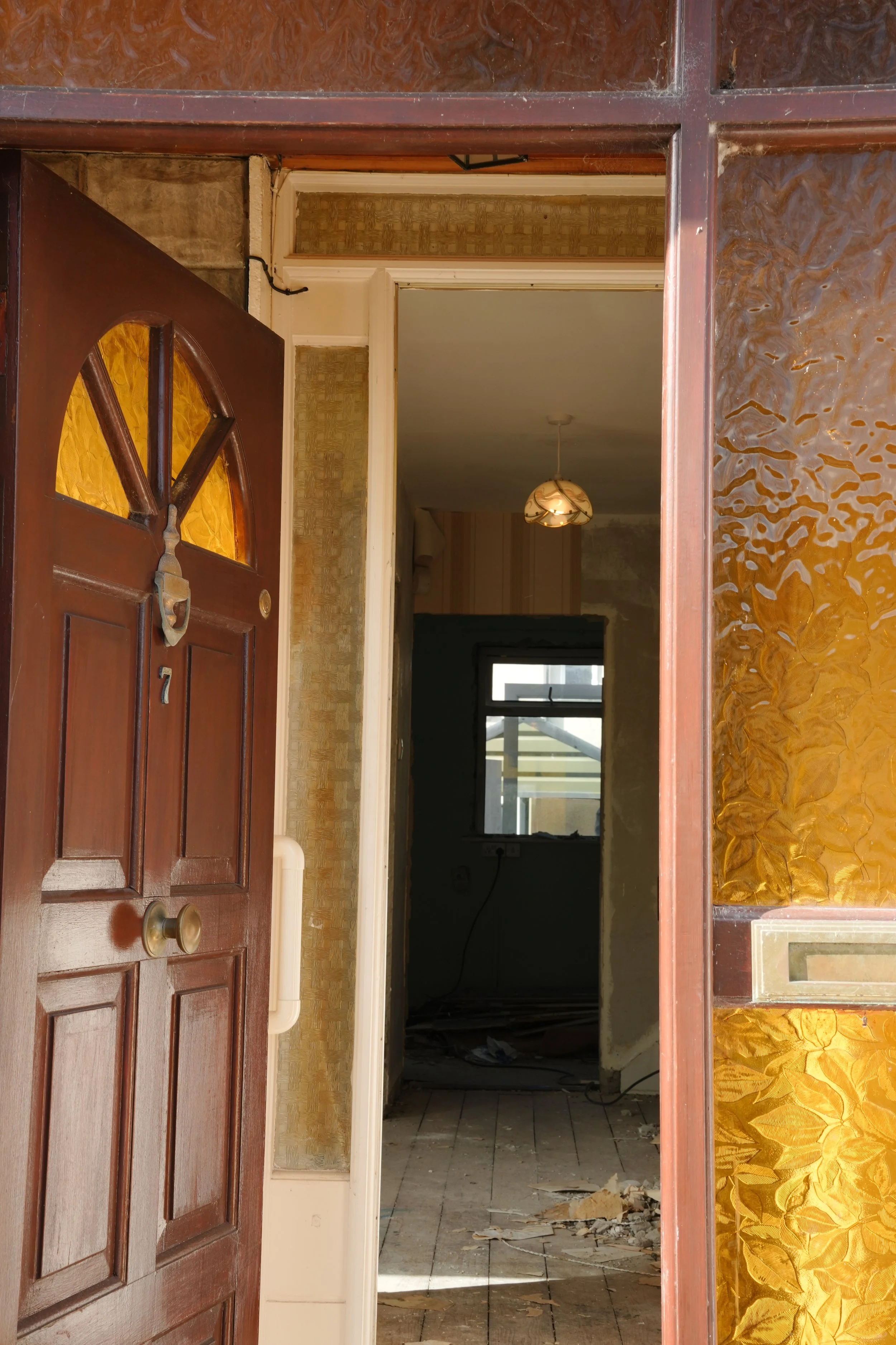 Residential renovation in Castleknock showing original front door and interior works in progress.