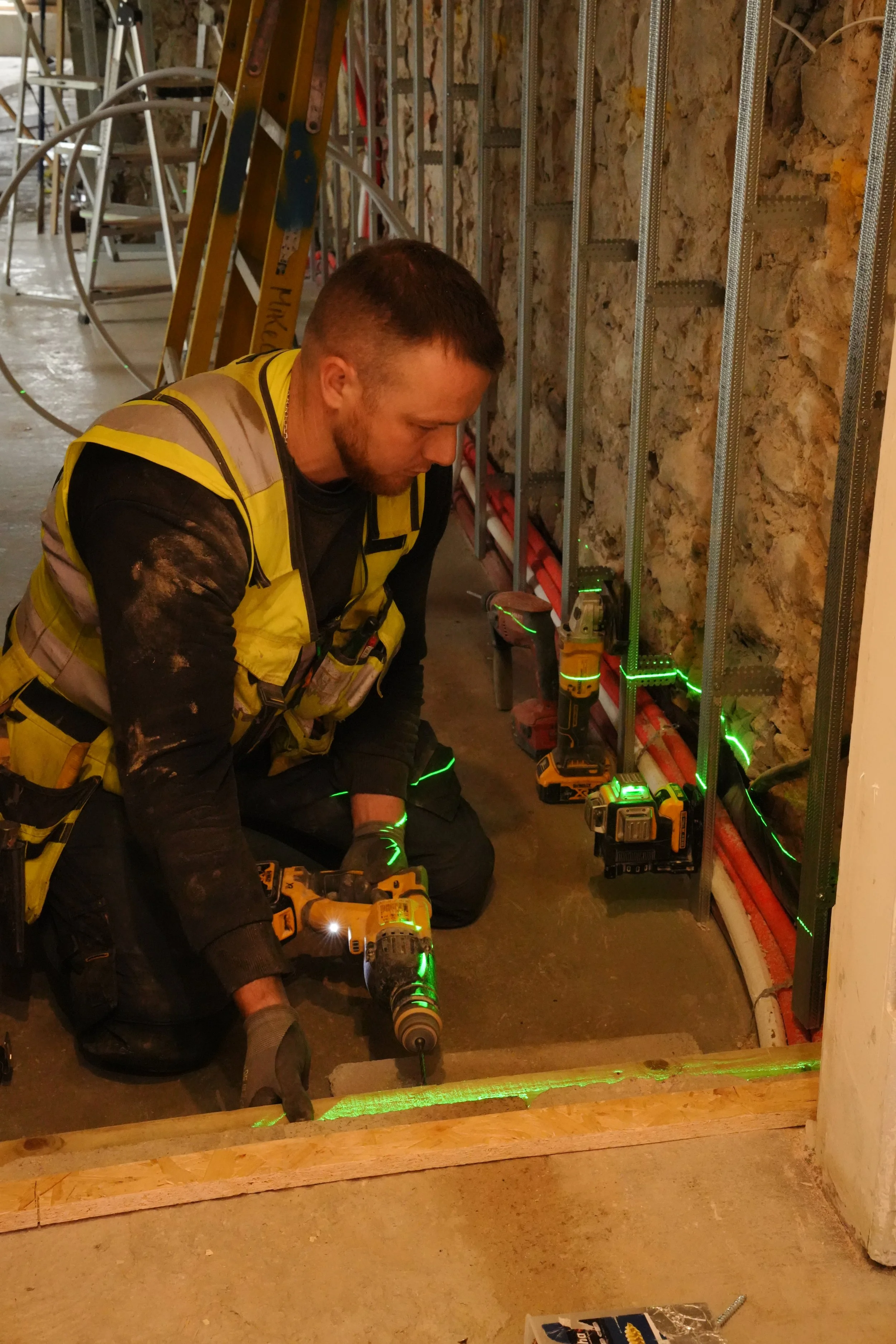 MikeConn team measuring with laser