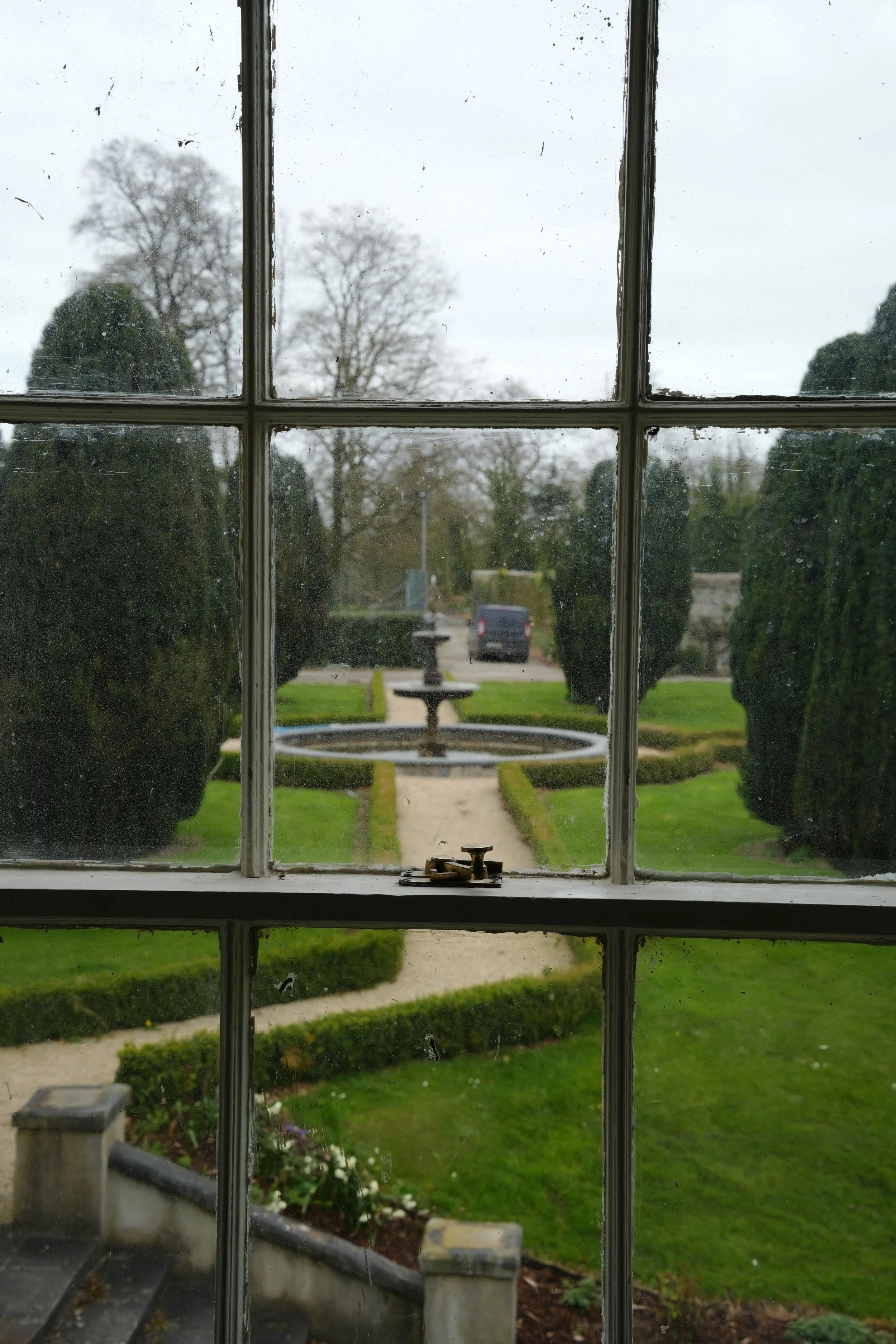 Original window looking out at water fountain