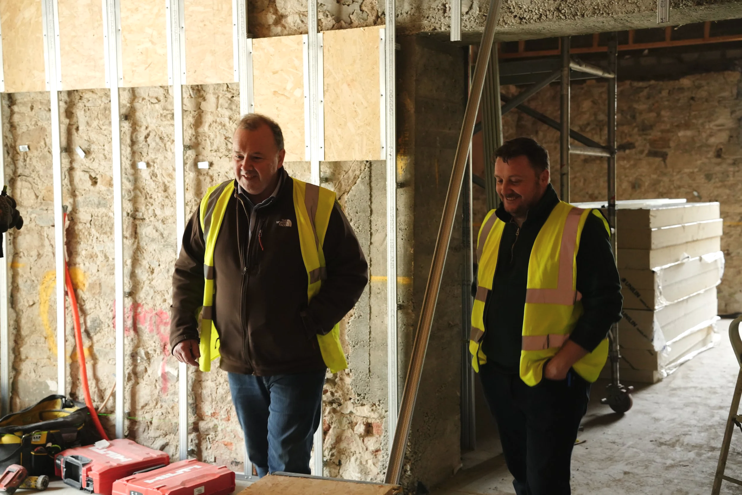 Founders Dessie and Pio of MikeConn on site during a construction project.