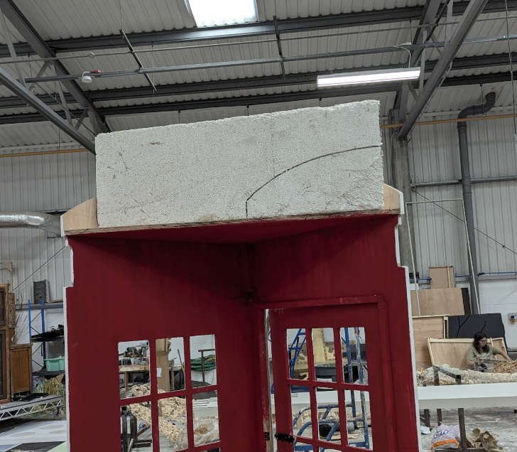 Carving the Top of a Telephone Box for Our House the Musical.  Designed. Reuben Dutch.