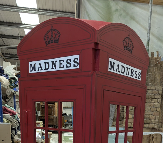 Carving the Top of a Telephone Box for Our House the Musical.  Designed. Reuben Dutch.