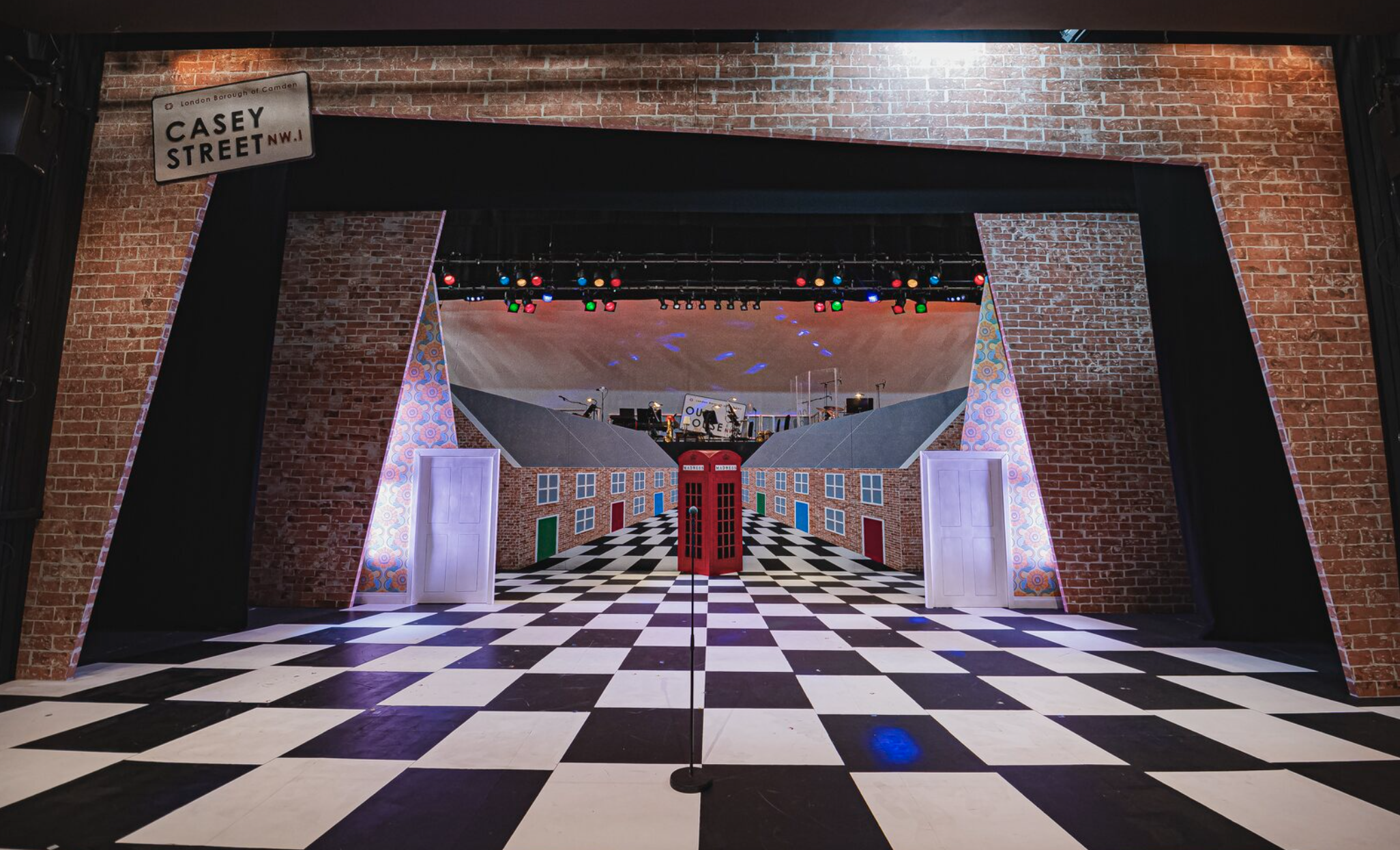 Our House the Musical Set, 2025. 
Playwright - Tim Firth
Director and Choreographer: Mark Smith
Set designer: Reuben Dutch
Costume designers: Evan Stead & Olivia Lewis
Lighting designer: Charlie Moore
Photographer: Kirsten McTernan
Scenic Lead - Heat
